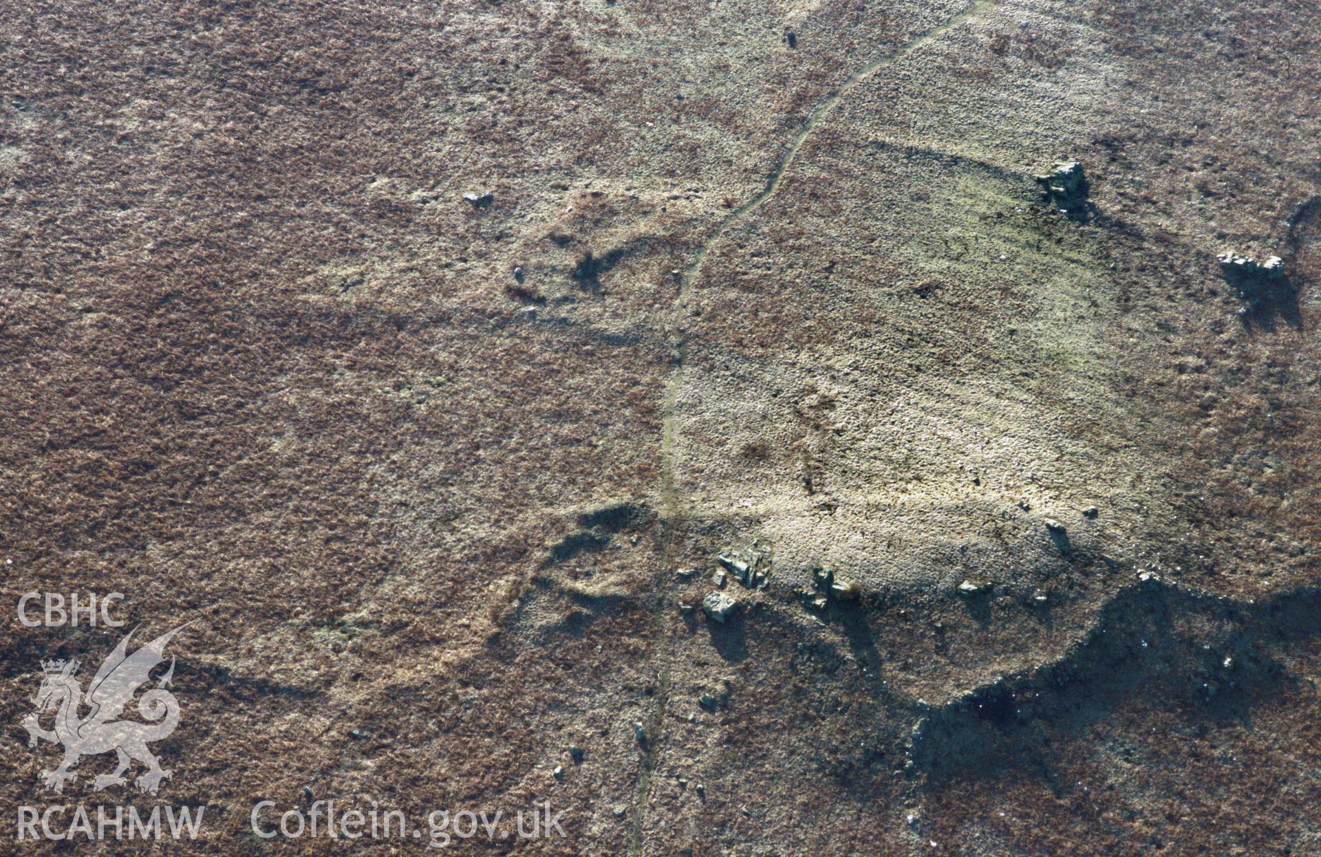 RCAHMW colour slide oblique aerial photograph of field system at Skomer Island, Marloes And St Brides, taken by C.R.Musson on the 27/02/1996