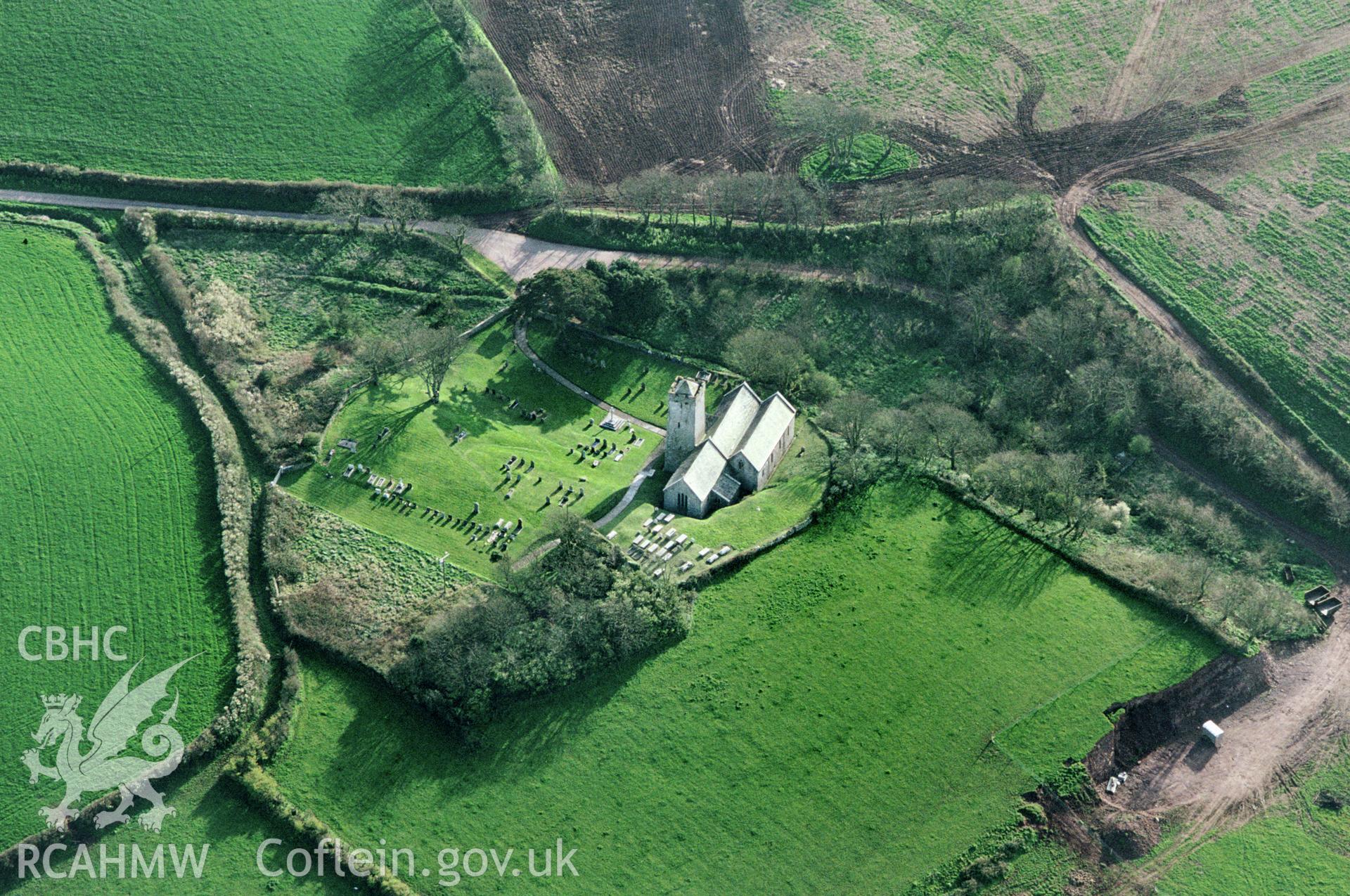 Slide of RCAHMW colour oblique aerial photograph of St Michaels Church, Castlemartin, taken by C.R. Musson, 1993.