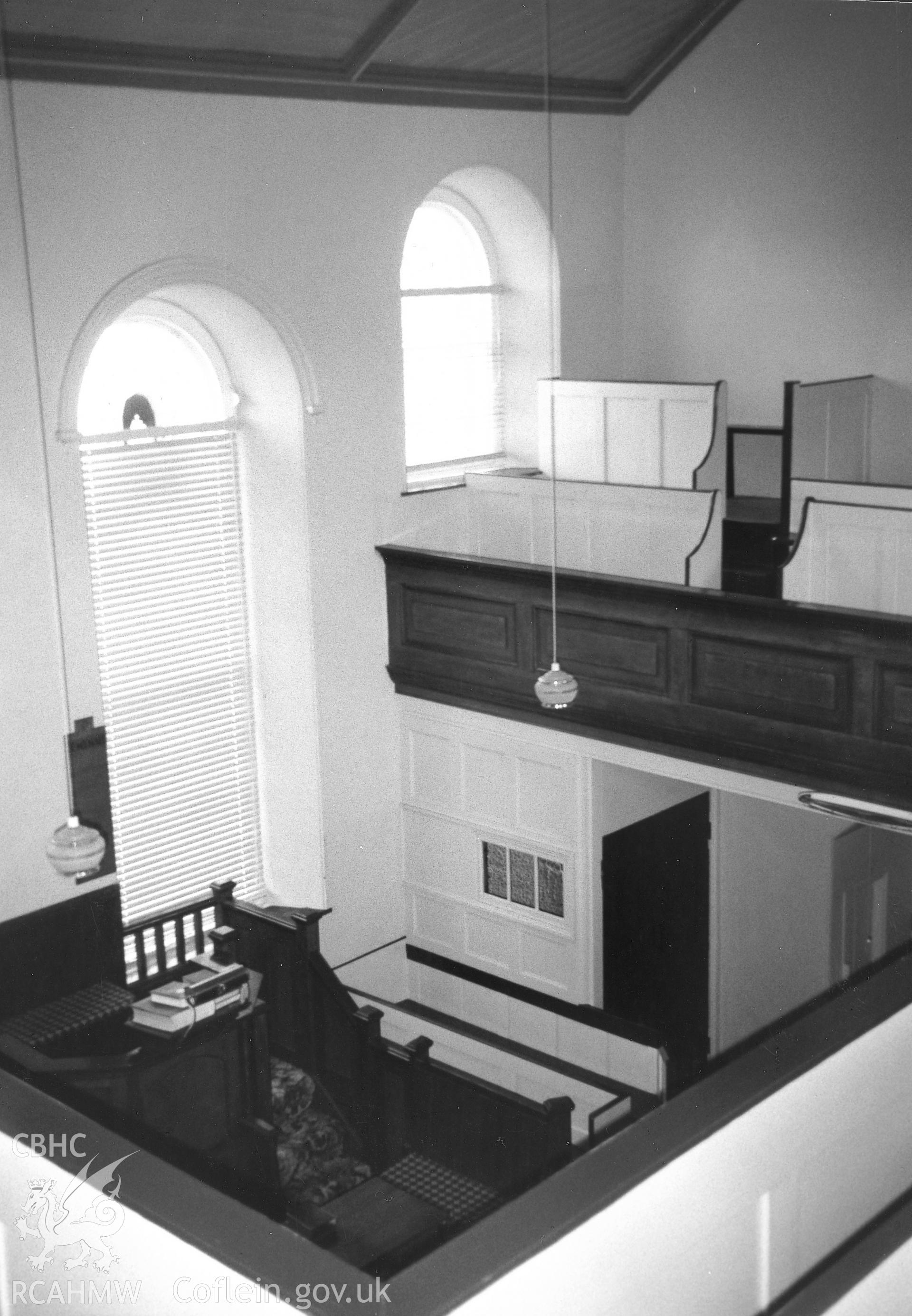 Digital copy of a black and white photograph showing an interior view of Nanternis Independent Chapel, taken by Robert Scourfield, 1995.