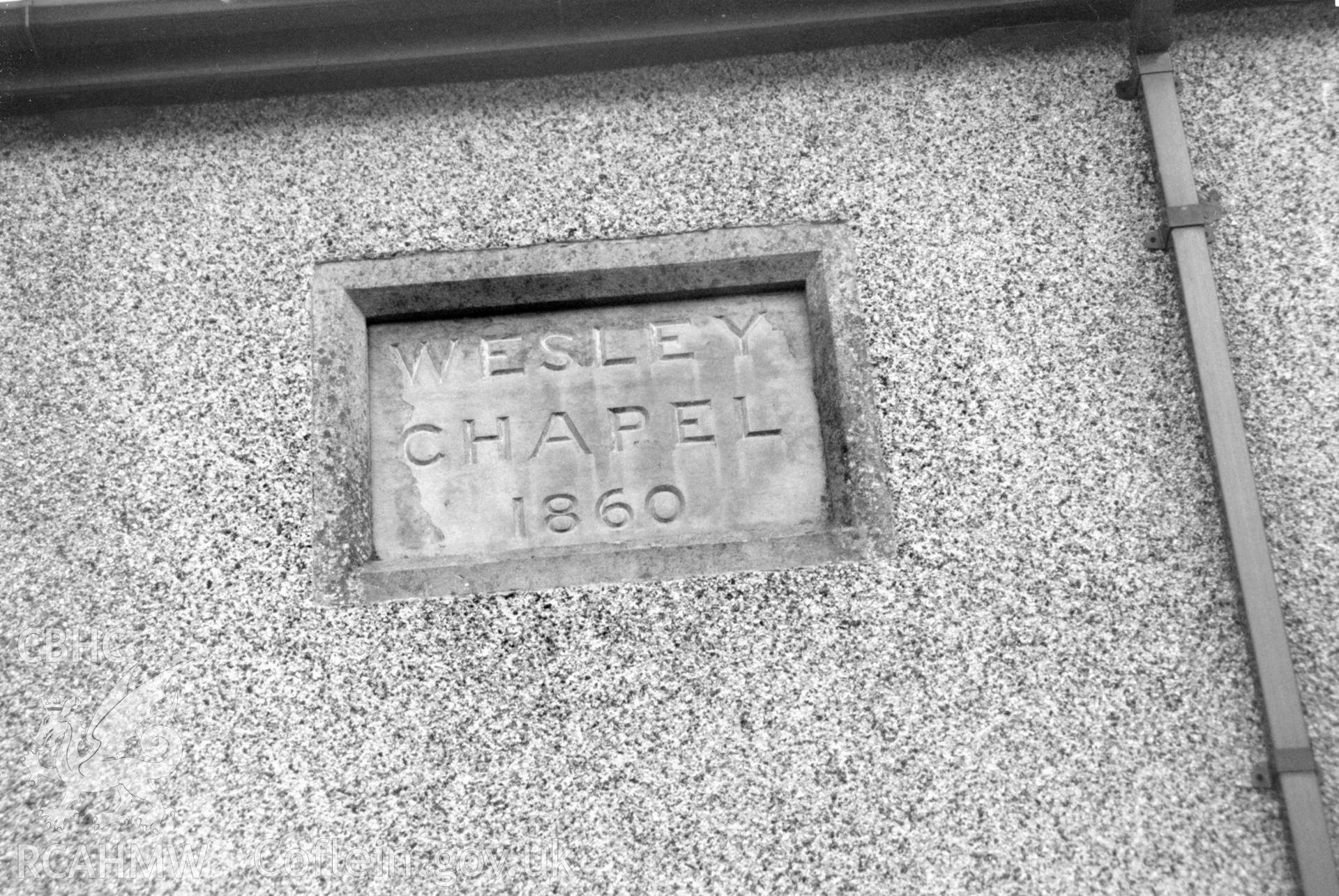 Digital copy of a black and white photograph showing detail of datestone at Stepaside Wesleyan Methodist Chapel, taken by Robert Scourfield, 1996.