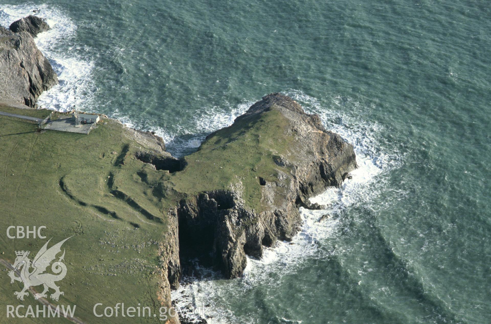 Slide of RCAHMW colour oblique aerial photograph of Buckspool Camp, Stackpole, taken by C.R. Musson, 1993