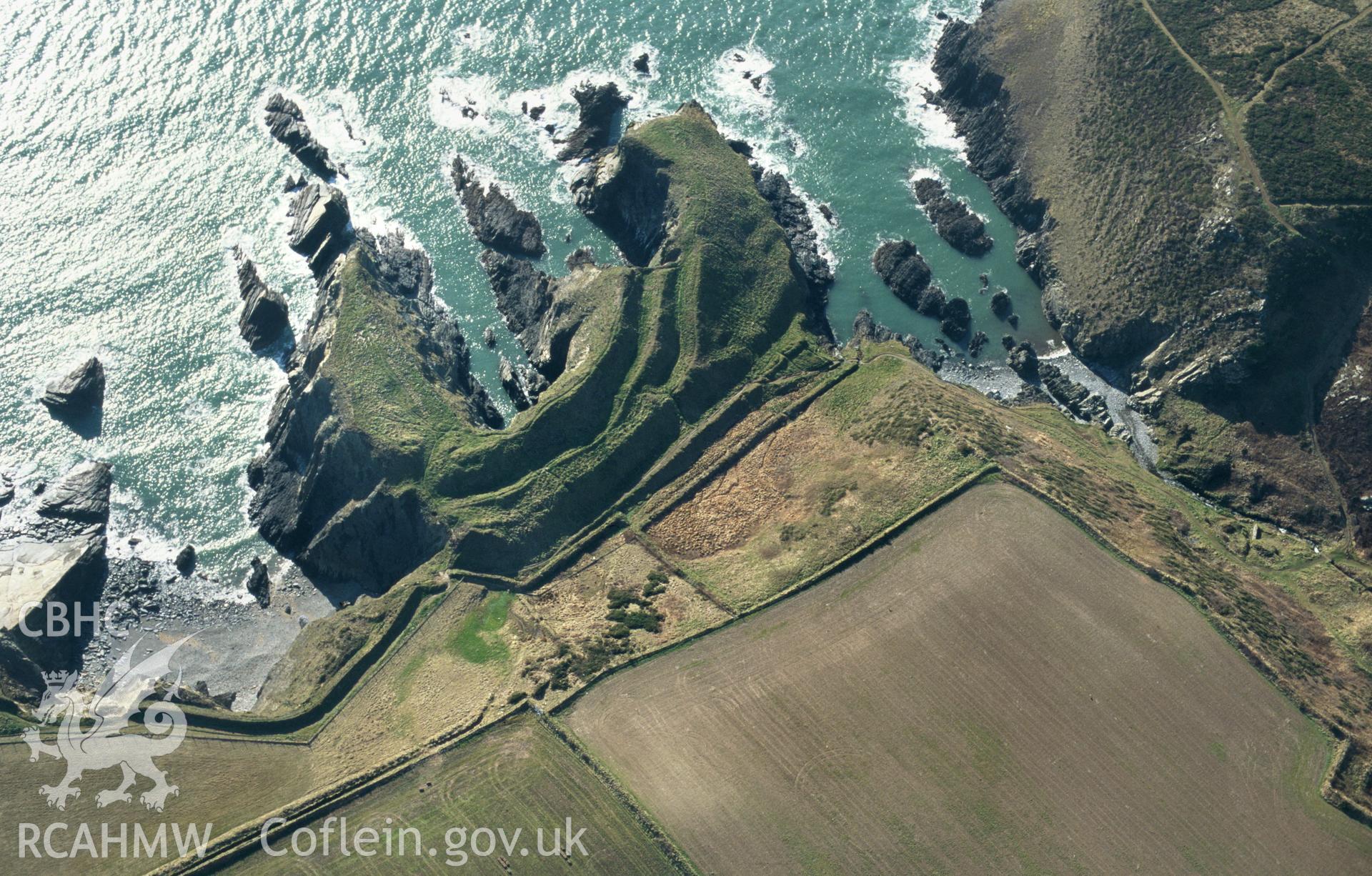 RCAHMW colour slide oblique aerial photograph of Porth-y-rhaw Promontary Fort, Solva, taken by C.R.Musson on the 27/02/1996
