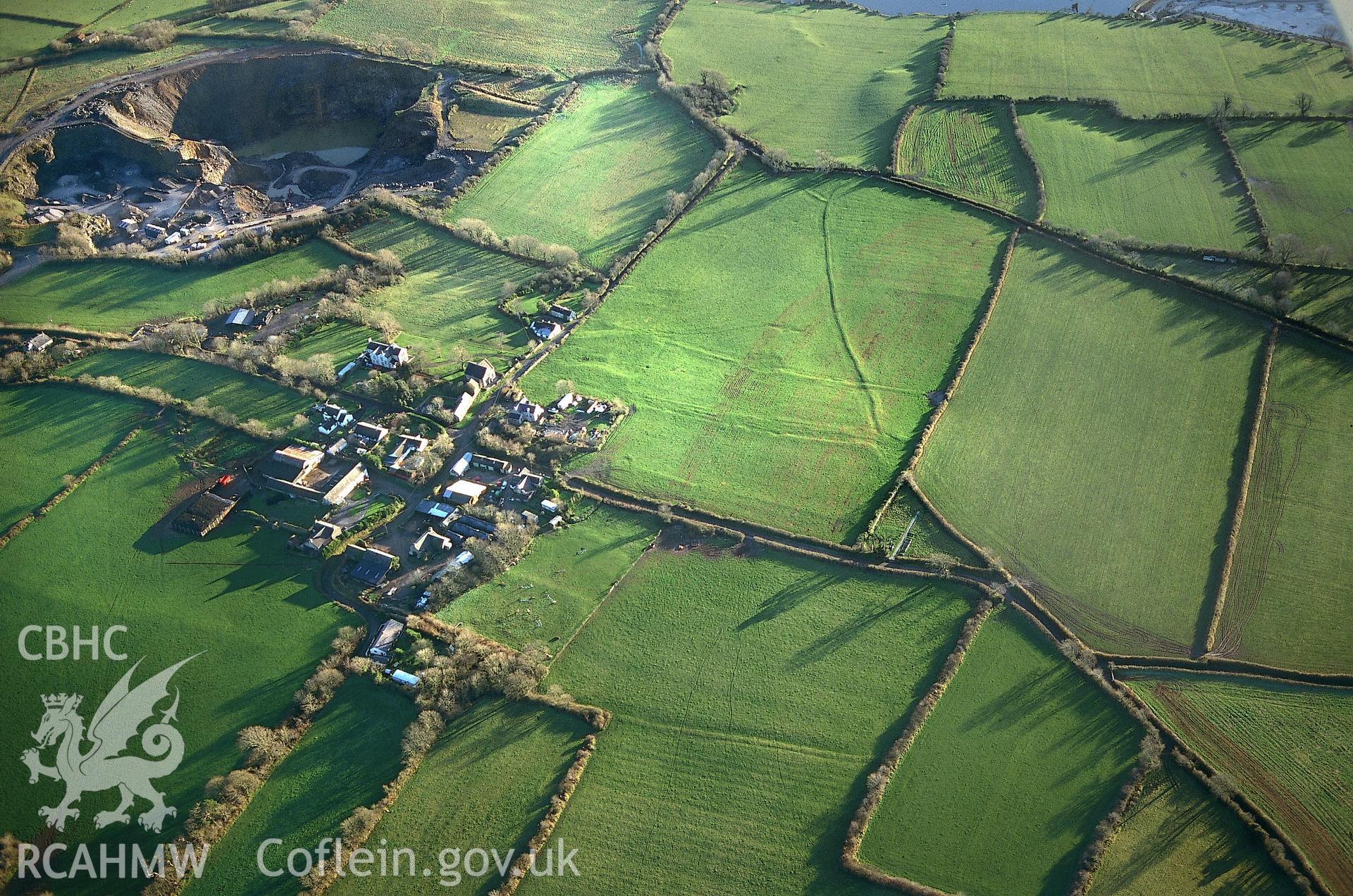 RCAHMW colour slide oblique aerial photograph of Carew Newton Village, Carew, taken by T.G.Driver on the 03/12/1997