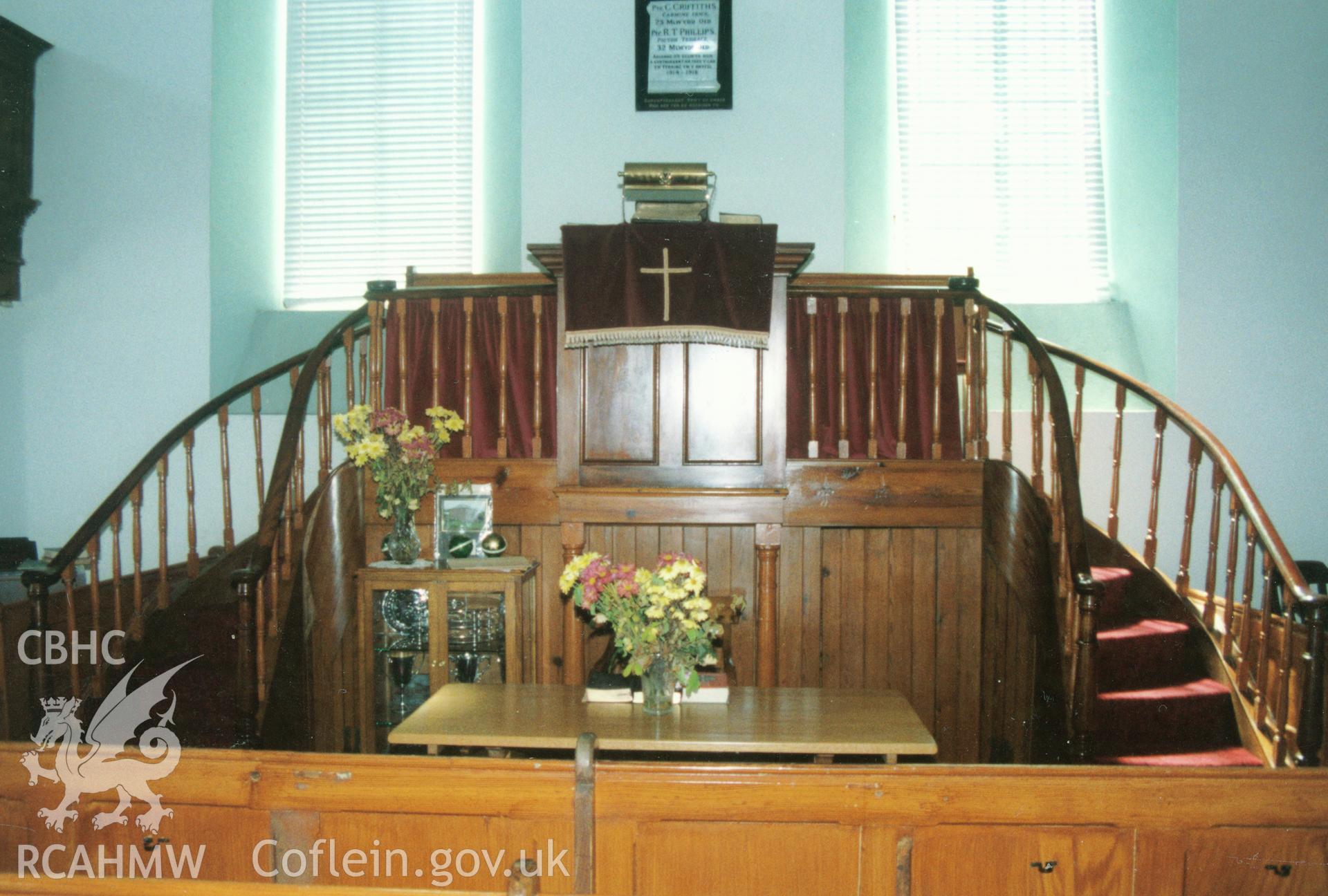 Digital copy of a colour photograph showing an interior view of Ffynnon Welsh Baptist Chapel, Llanddewi Velfrey, taken by Robert Scourfield, 1996.