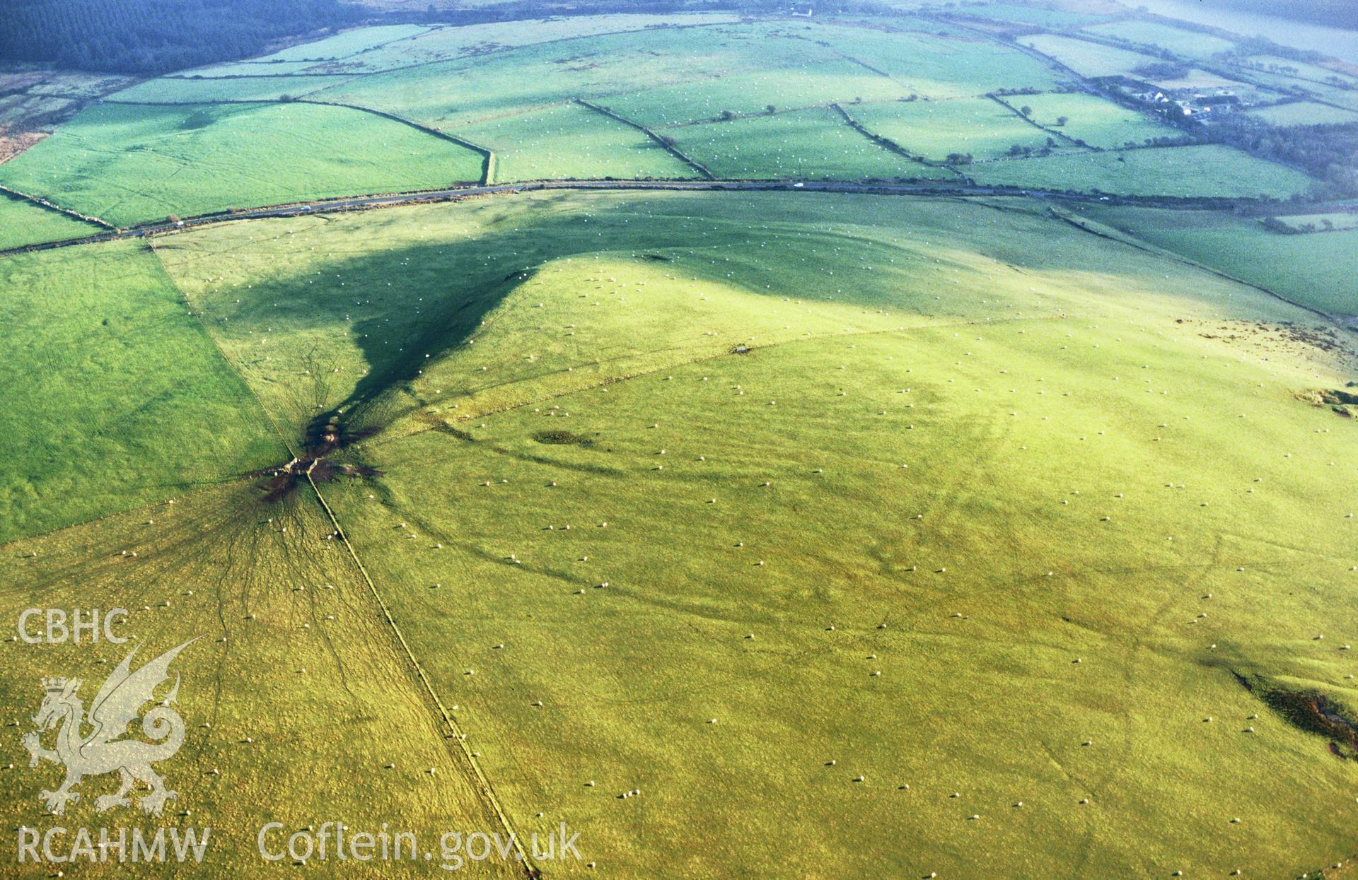 RCAHMW colour slide aerial photograph of Banc Du, causewayed enclosure, from northwest. Taken by Toby Driver on 13/12/2002