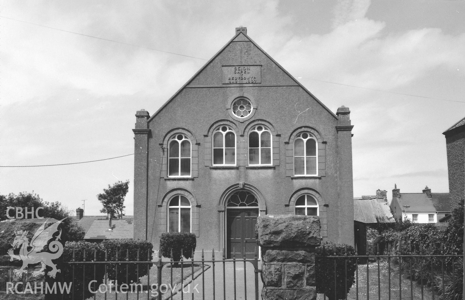 Digital copy of a black and white photograph showing an exterior view of Seion Welsh Baptist Chapel, St David's,  taken by Robert Scourfield, 1995.