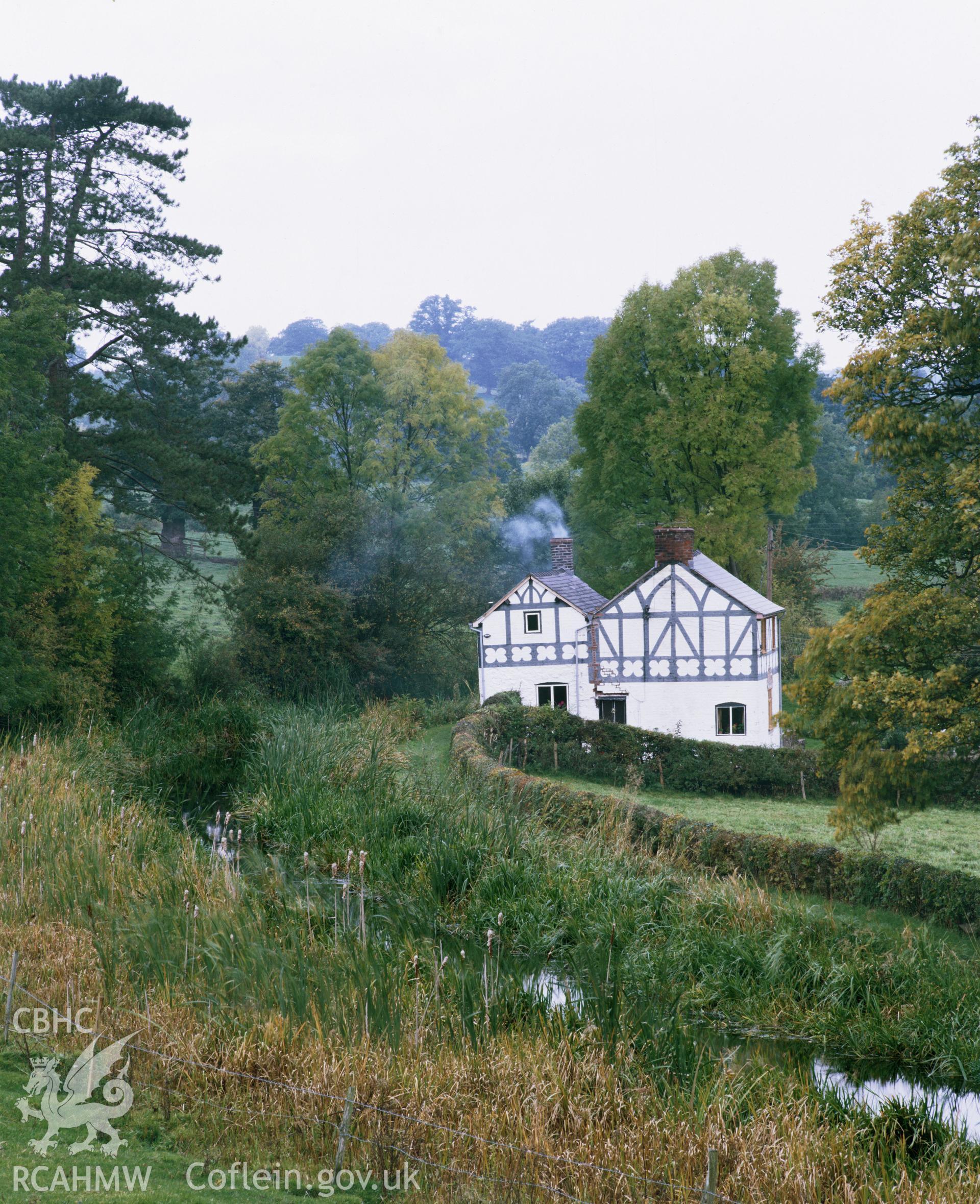 Colour transparency showing a view of Sawmill Cottage, Garthmyl, produced by RCAHMW, c.1980
