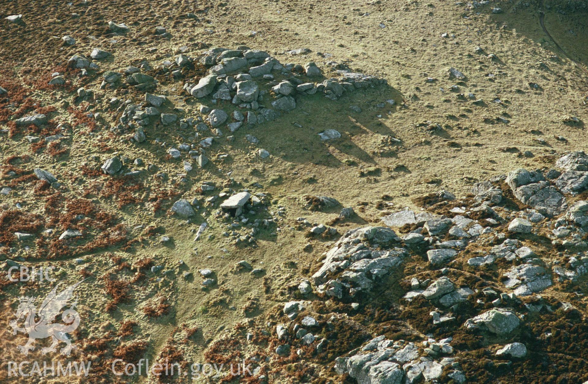 RCAHMW colour slide oblique aerial photograph of Coetan Arthur Burial Chamber, St Davids And The Cathedral Close, taken by C.R. Musson, 16/01/94