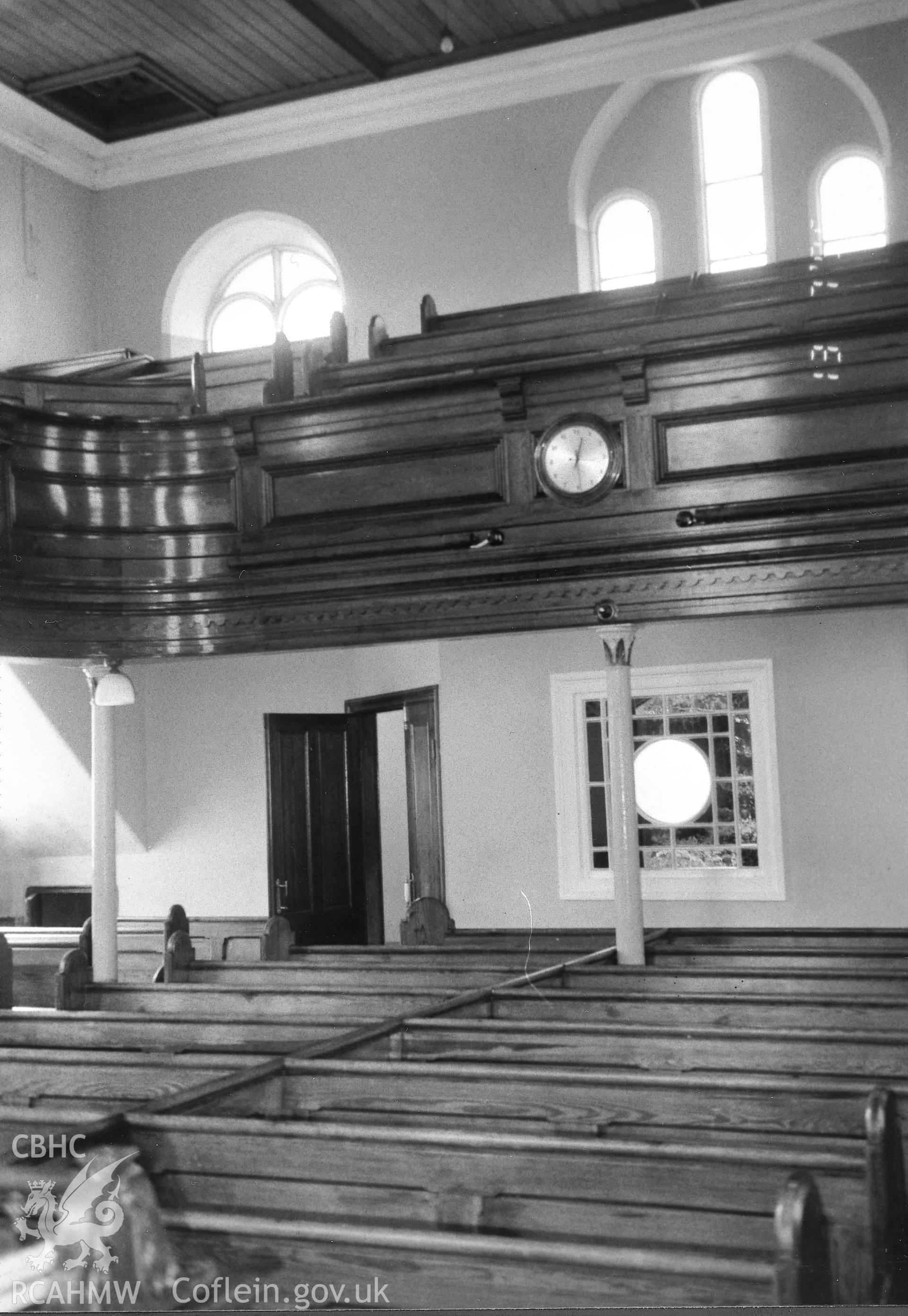 Digital copy of a black and white photograph showing an interior view of Bryngwenith Independent Chapel, Llandyfriog, taken by Robert Scourfield, 1995.