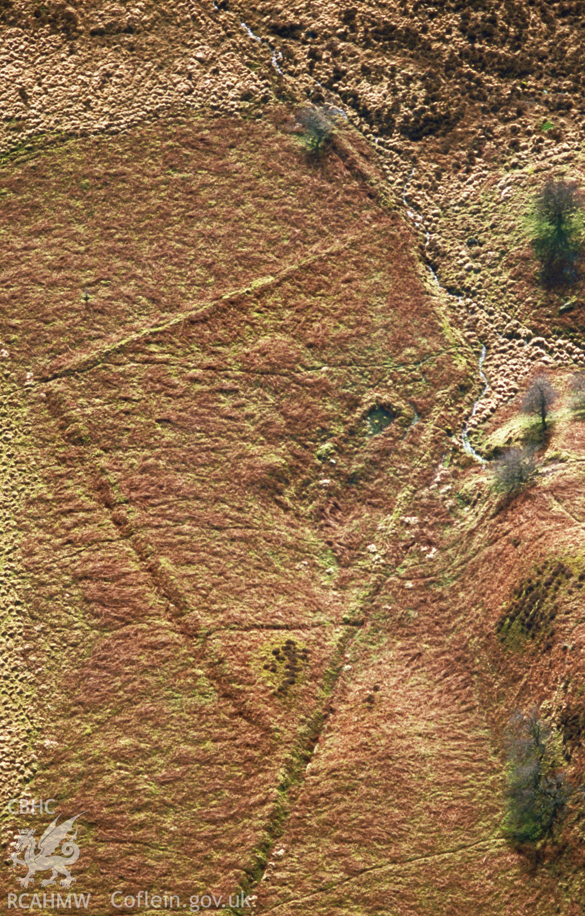Slide of RCAHMW colour oblique aerial photograph of Craig Cerrig-Gleisiad Enclosure,Glyn Tarell, taken by T.G. Driver, 2001.