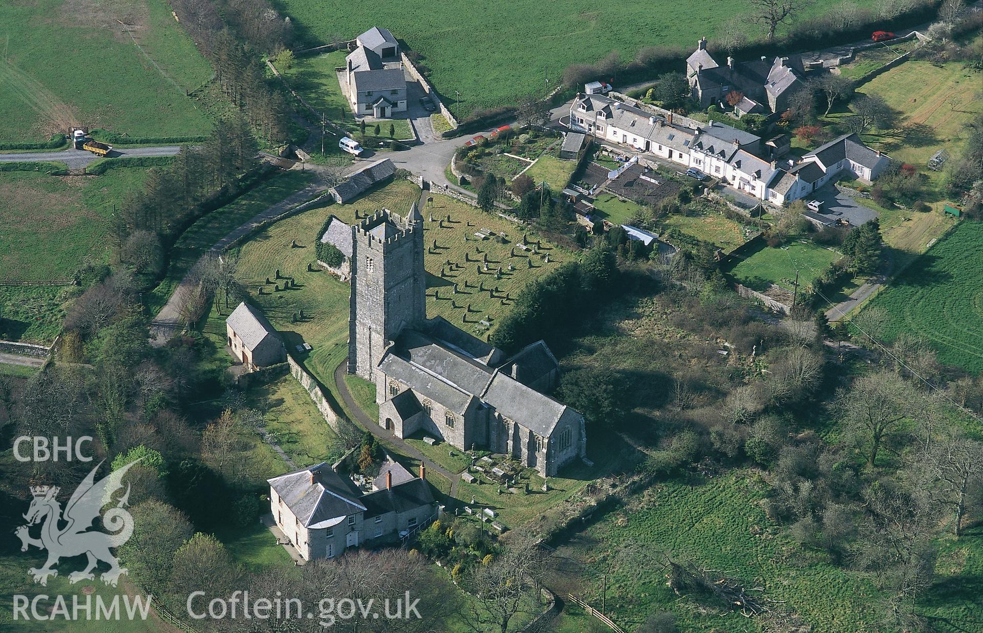 Slide of RCAHMW colour oblique aerial photograph of the church at Carew Cheriton, taken by C.R. Musson, 13/4/1995.