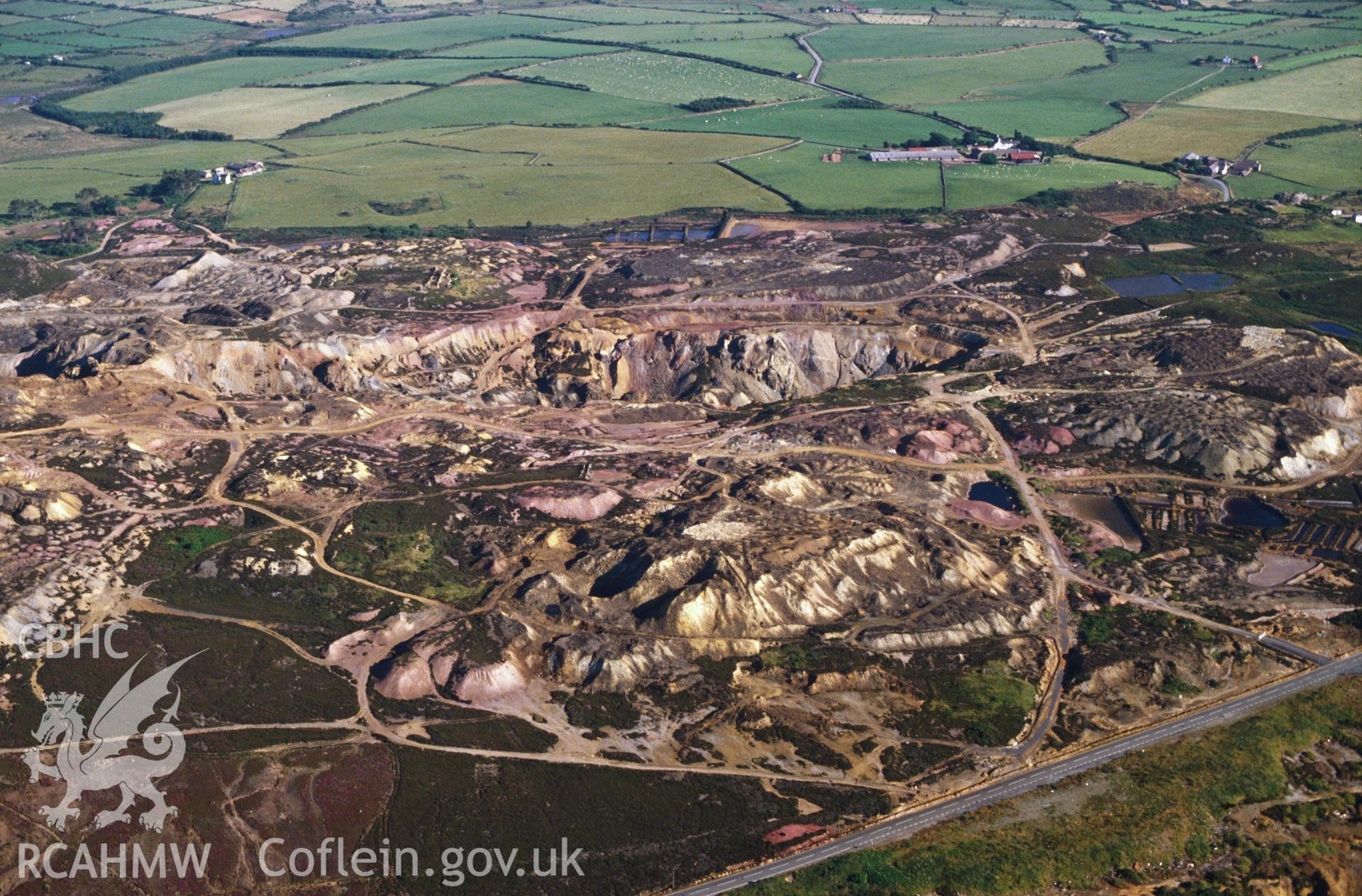 Slide of RCAHMW colour oblique aerial photograph of Parys Mountain Copper Mines, Amlwch, taken by C.R. Musson, 11/7/1989.