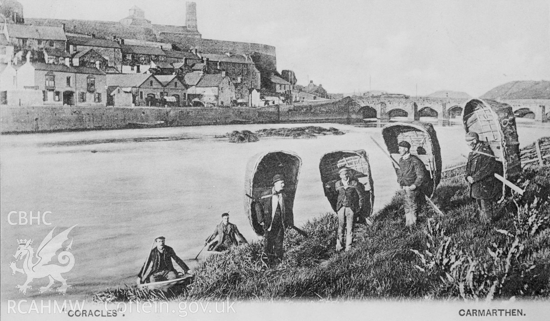 Copy of a black and white Francis Frith postcard of unknown date, showing coracle men at Carmarthen Harbour.