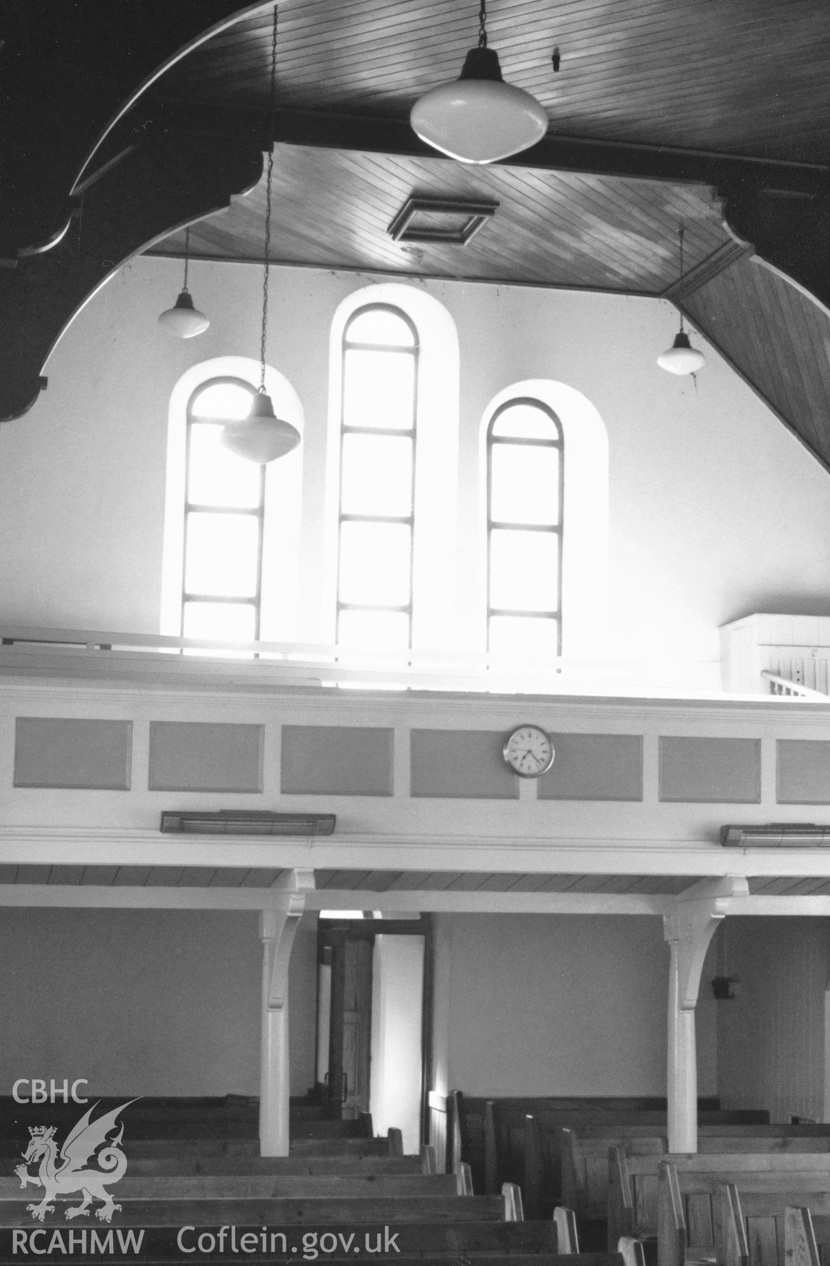 Digital copy of a black and white photograph showing an interior view of Hephzibah English Baptist Chapel, Honeyborough, taken by Robert Scourfield, 1996.