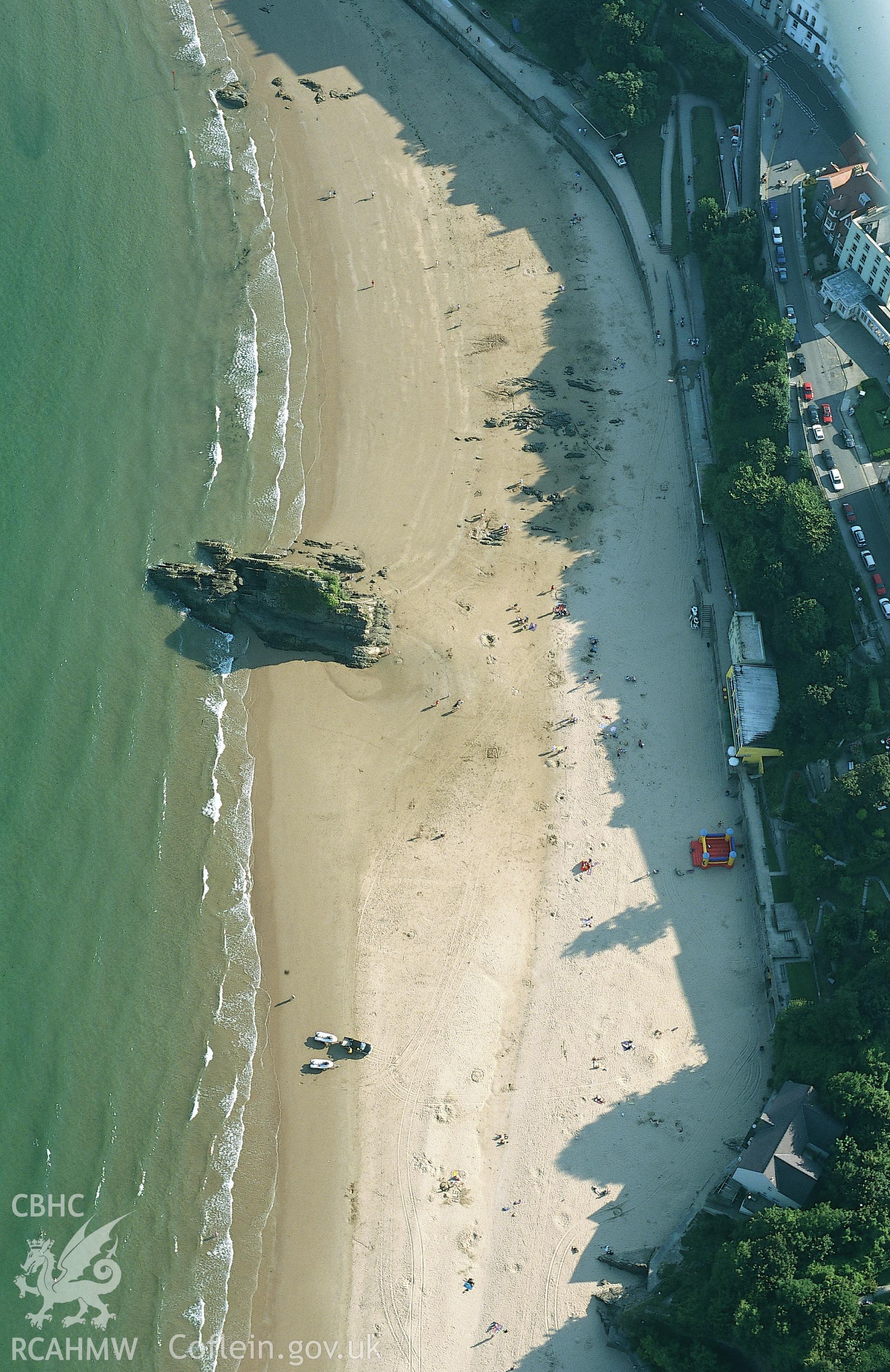 RCAHMW colour oblique aerial photograph of Tenby, north beach, and Goscar Rock, landscape. Taken by Toby Driver on 02/09/2002