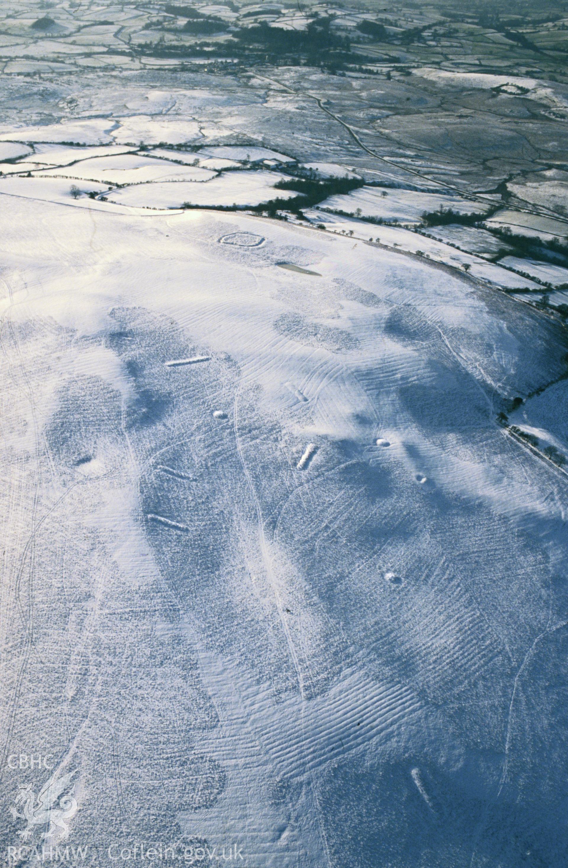 RCAHMW colour slide oblique aerial photograph of Coed Swydd Pillow Mounds, Penybont, taken on 11/01/1992 by CR Musson