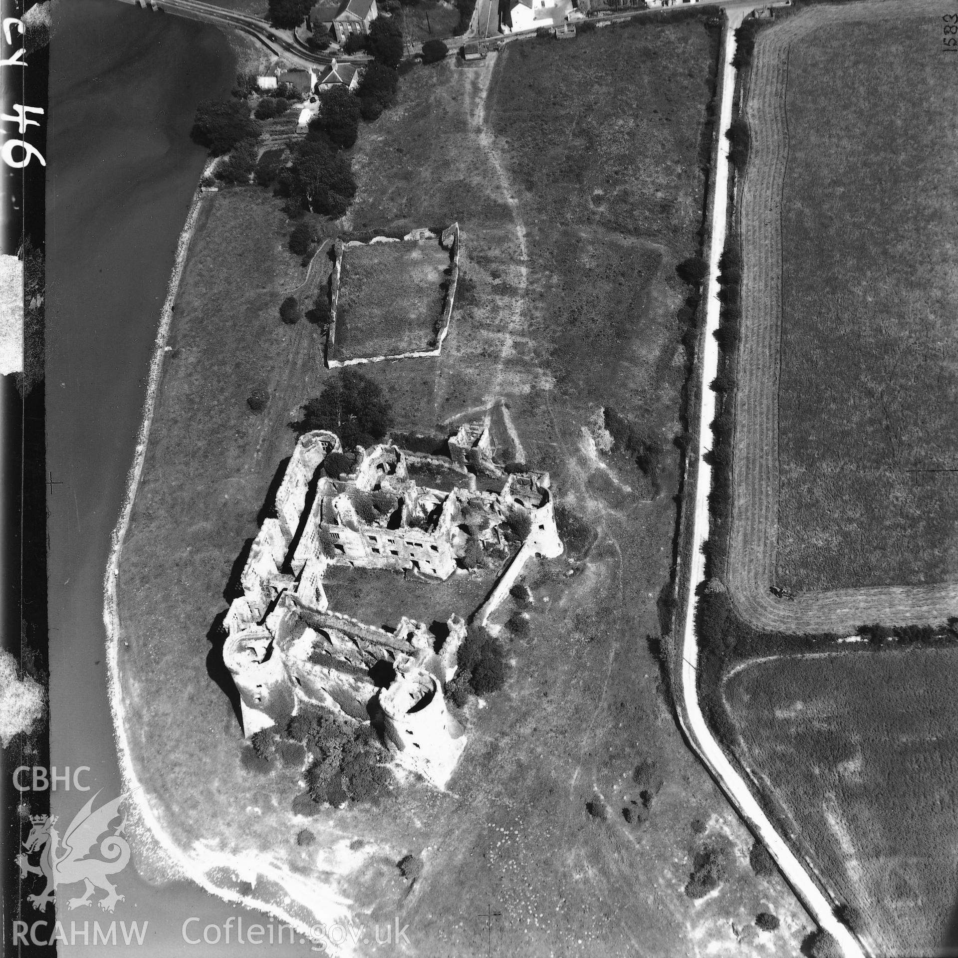 Black and white aerial photograph showing Carew Castle, taken by Cambridge University Committee for Aerial Photography.