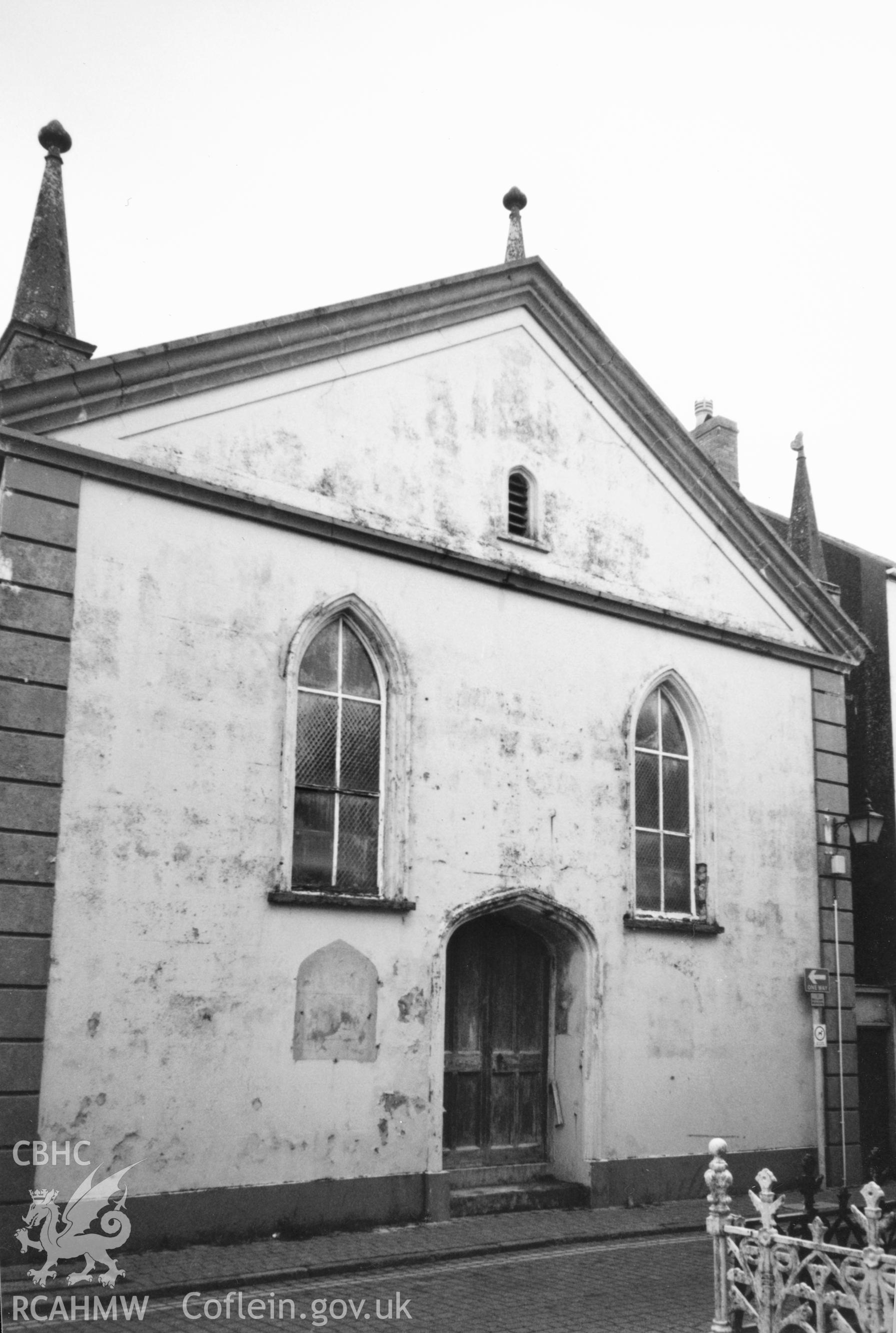 Digital copy of a black and white photograph showing exterior view of Tabernacle Calvinistic Methodist Chapel, Tenby, taken by Robert Scourfield, 1996.