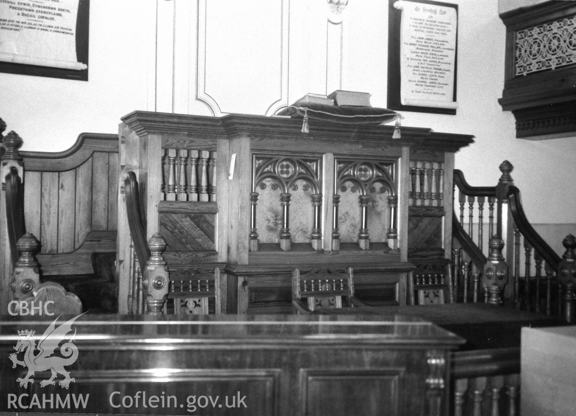 Digital copy of a black and white photograph showing an interior view of Gwernllwyn Independent Chapel, Llandyfriog, taken by Robert Scourfield, 1995.