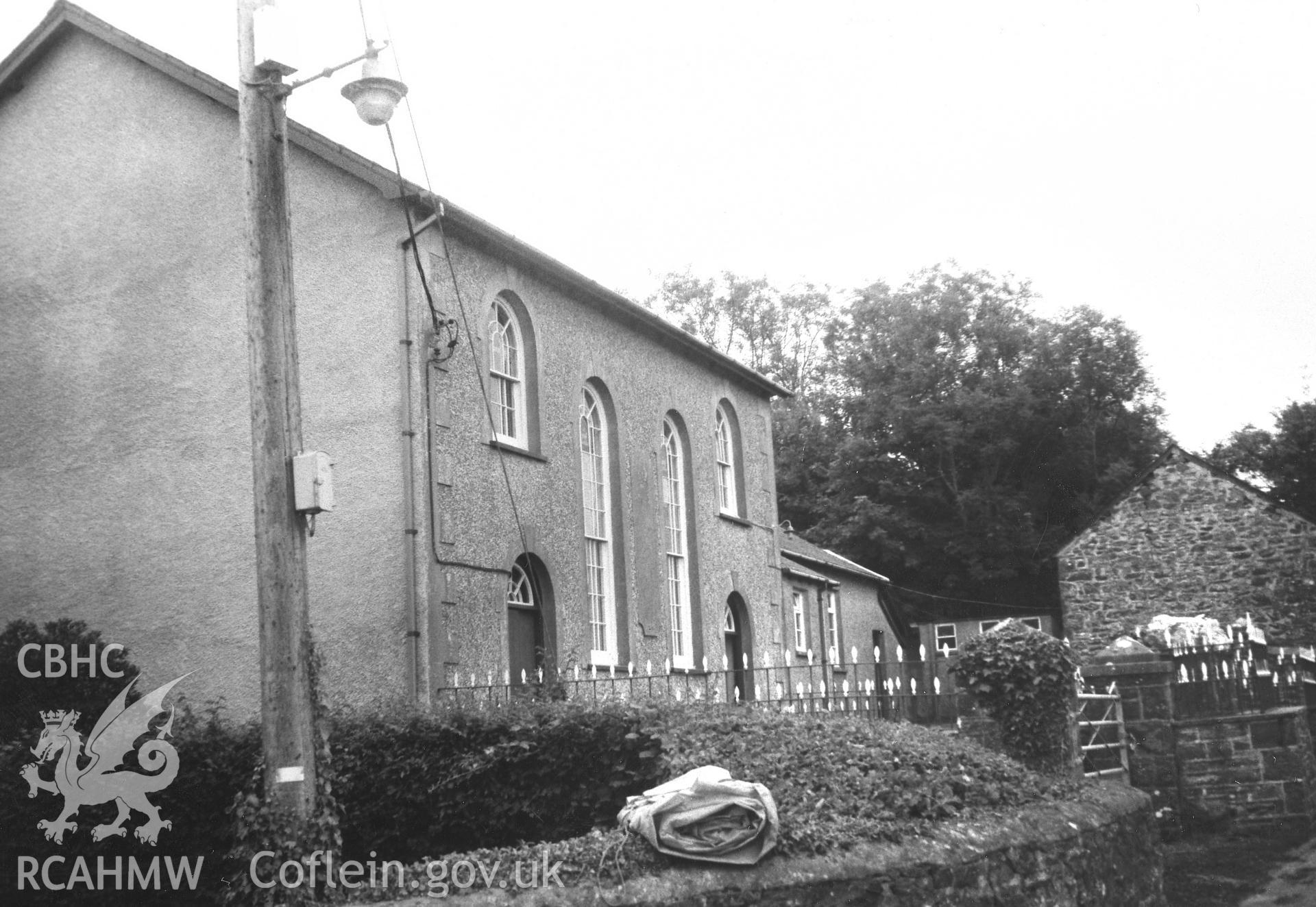 Digital copy of a black and white photograph showing an exterior view of Nanternis Independent Chapel, taken by Robert Scourfield, 1995.