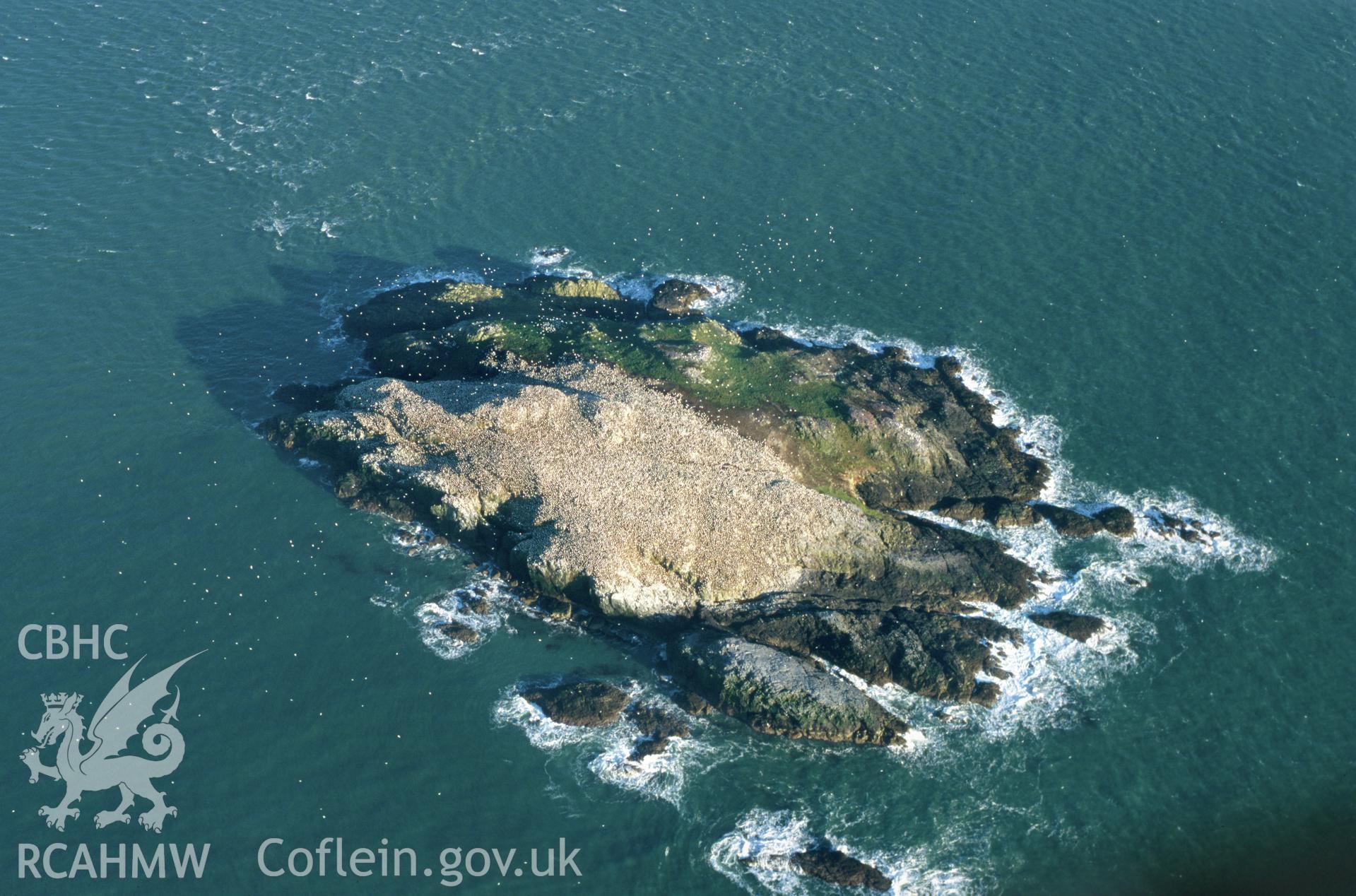 Slide of RCAHMW colour oblique aerial photograph of Grassholm Island, taken by T.G. Driver, 2001.