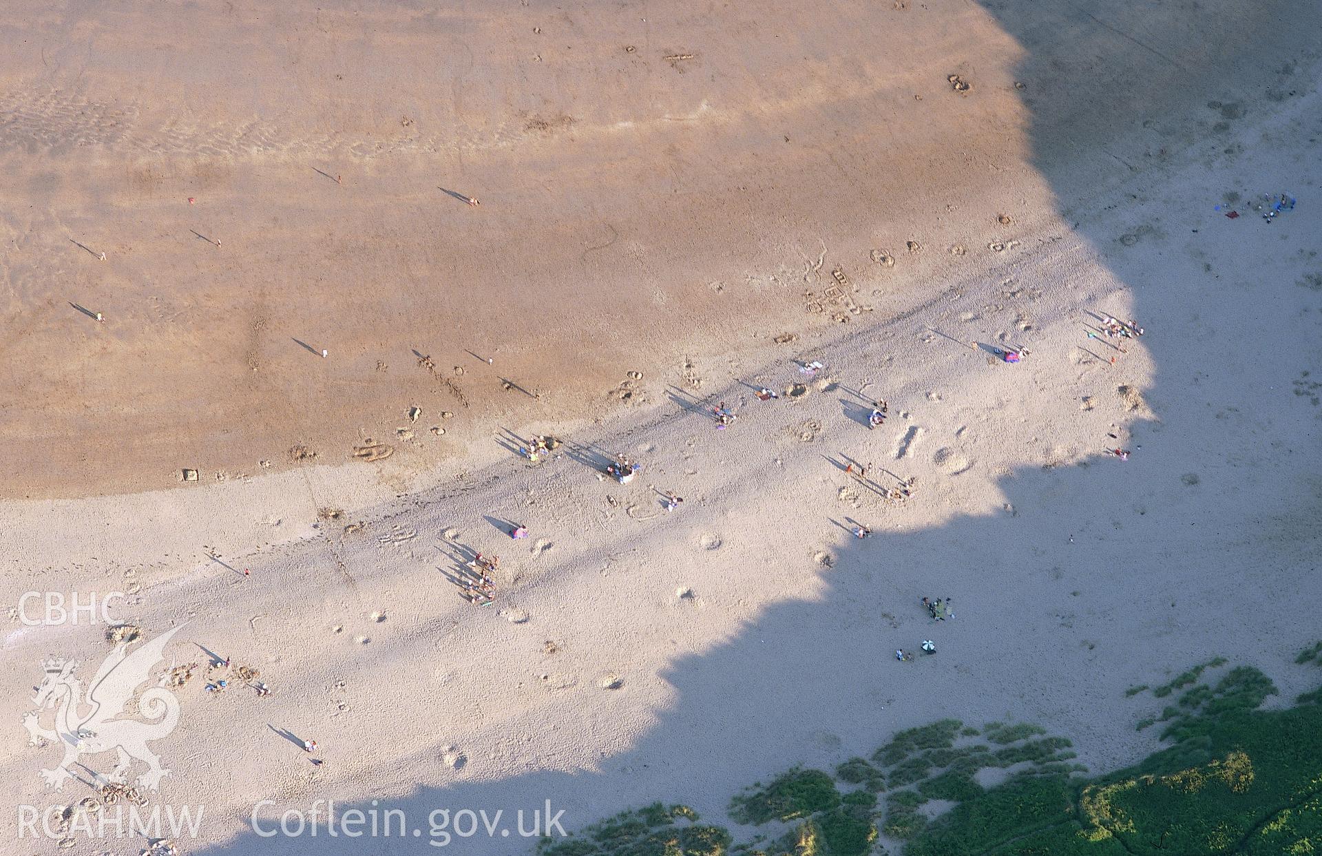 RCAHMW colour slide oblique aerial photograph of Broadhaven, bathers on the beach, Stackpole, taken by T.G.Driver on the 23/08/2000