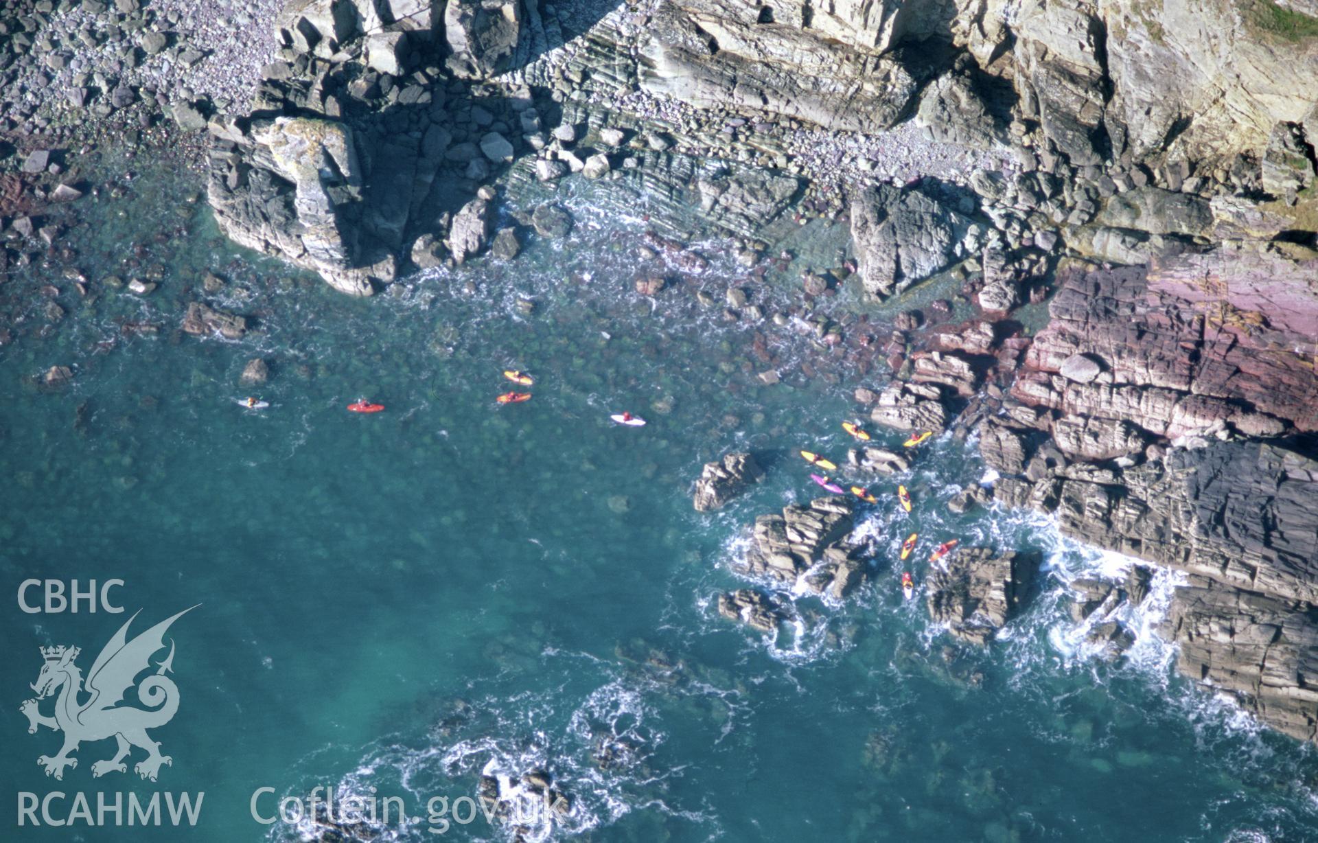 Slide of RCAHMW colour oblique aerial photograph of the coast at St Non's, St Davids, taken by Toby Driver, 2002.