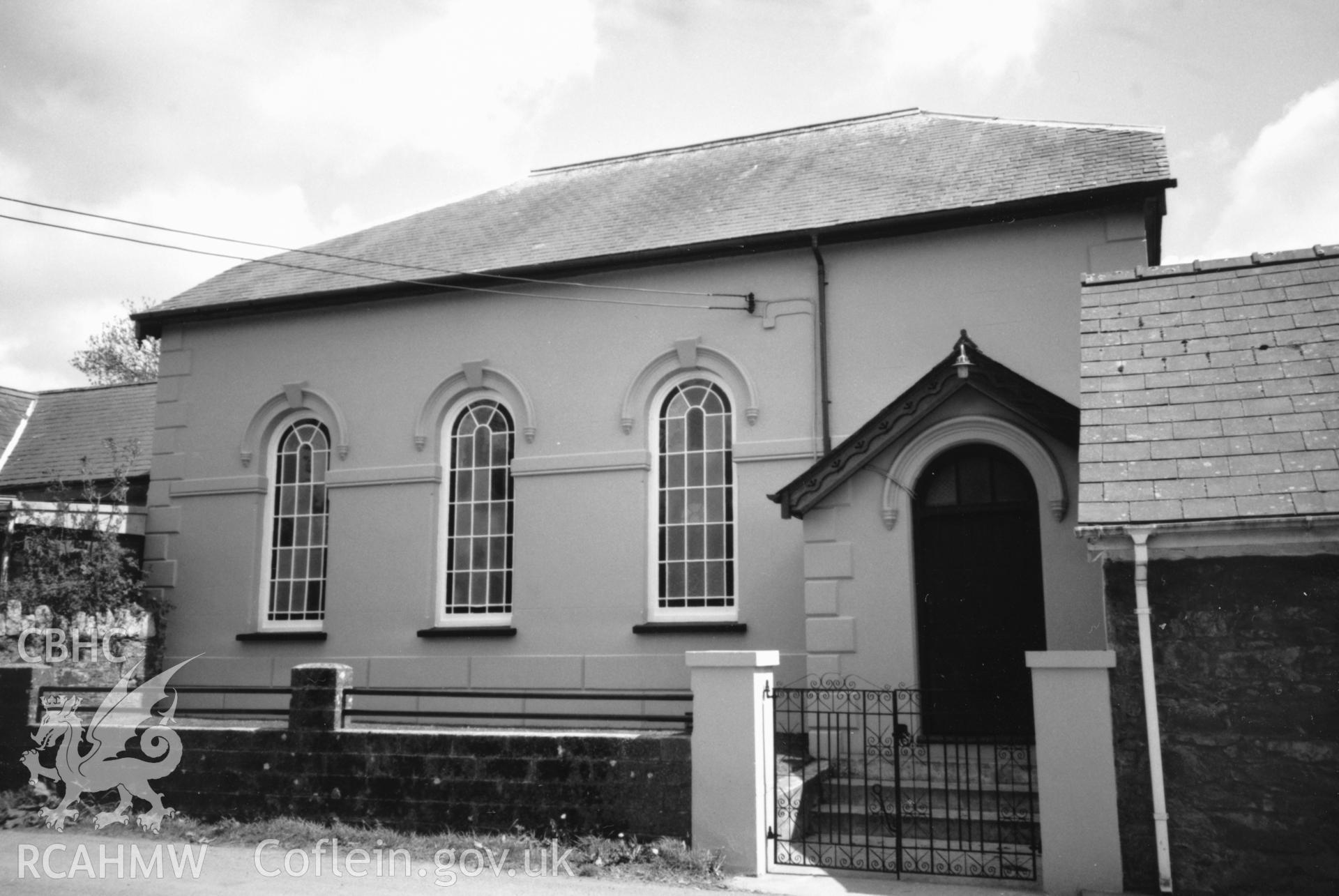 Digital copy of a black and white photograph showing an exterior view of Gwastad Calvinistic Methodist Chapel, taken by Robert Scourfield, 1996.