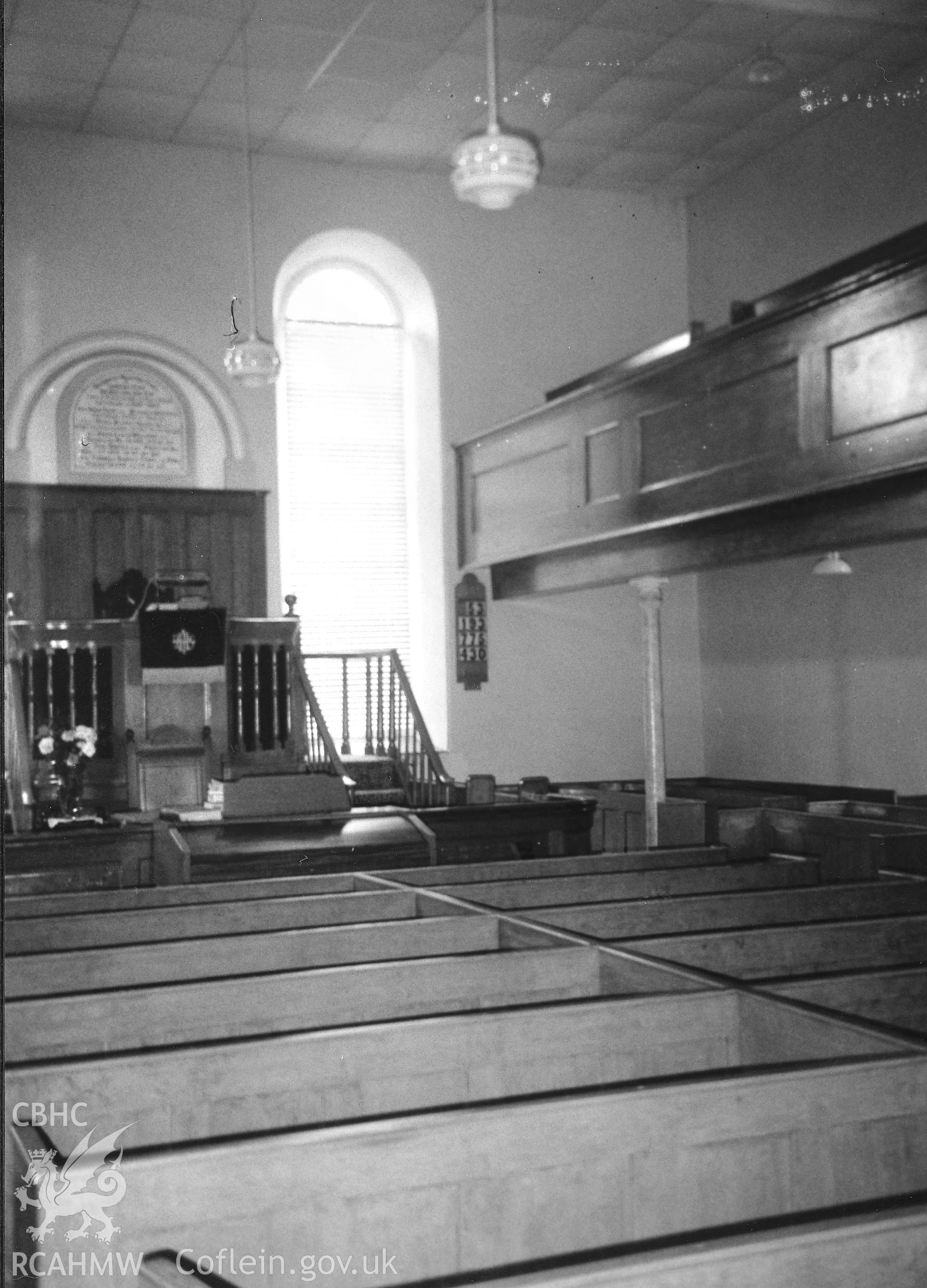Digital copy of a black and white photograph showing an interior view of Pisgah Independent Chapel, taken by Robert Scourfield, 1995.