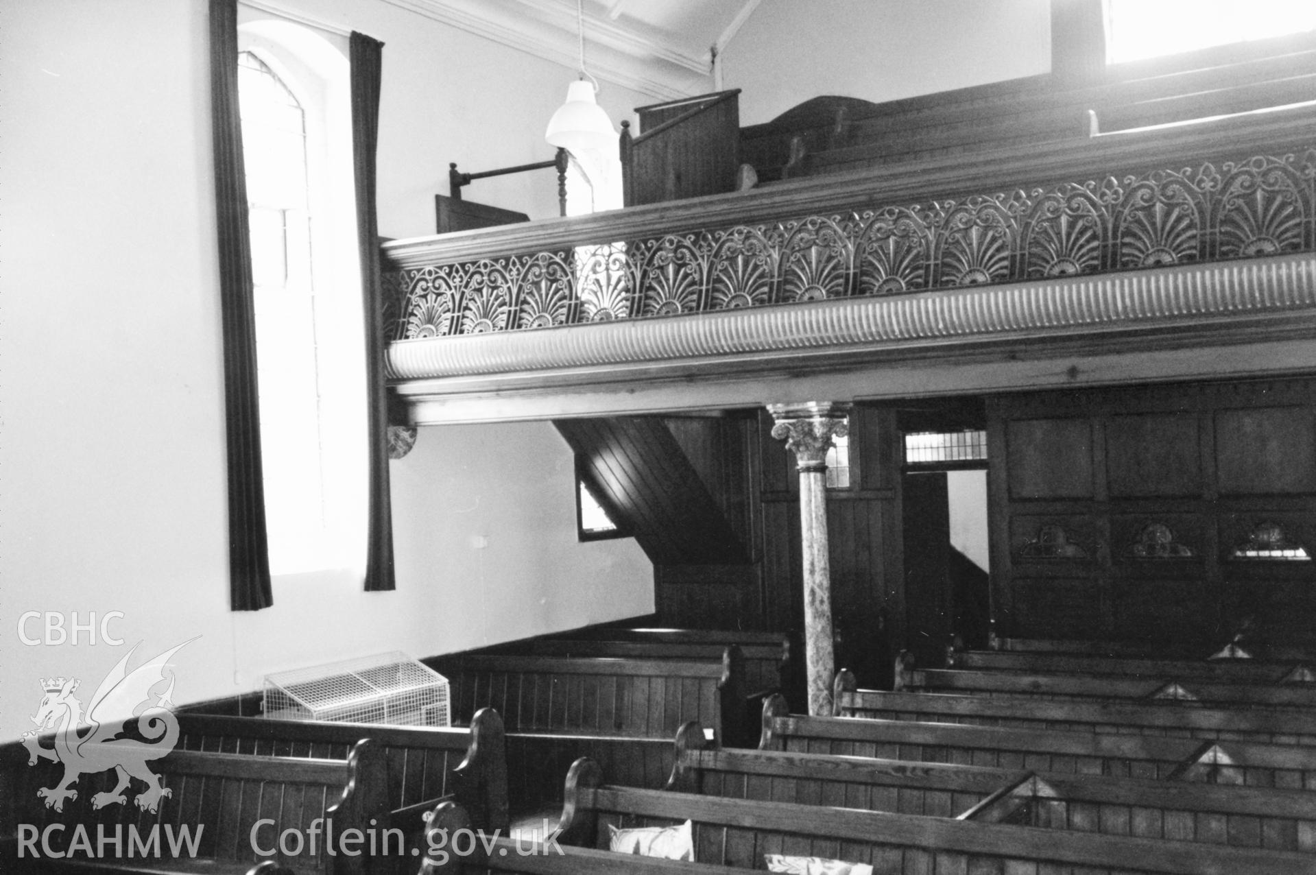 Digital copy of a black and white photograph showing an interior view of Neyland  English Wesleyan Methodist Chapel,  taken by Robert Scourfield, 1996.