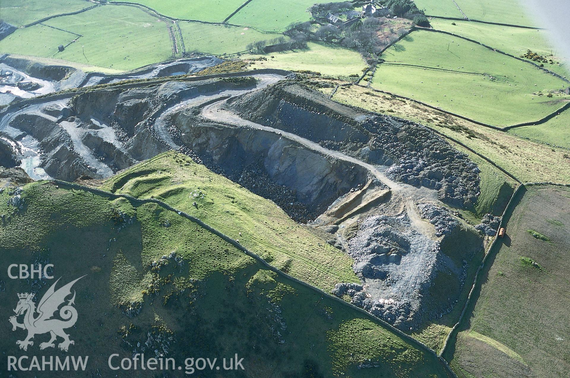 Slide of RCAHMW colour oblique aerial photograph of Tal Y Gareg,  Hill Fort, taken by T.G. Driver, 17/3/1999.