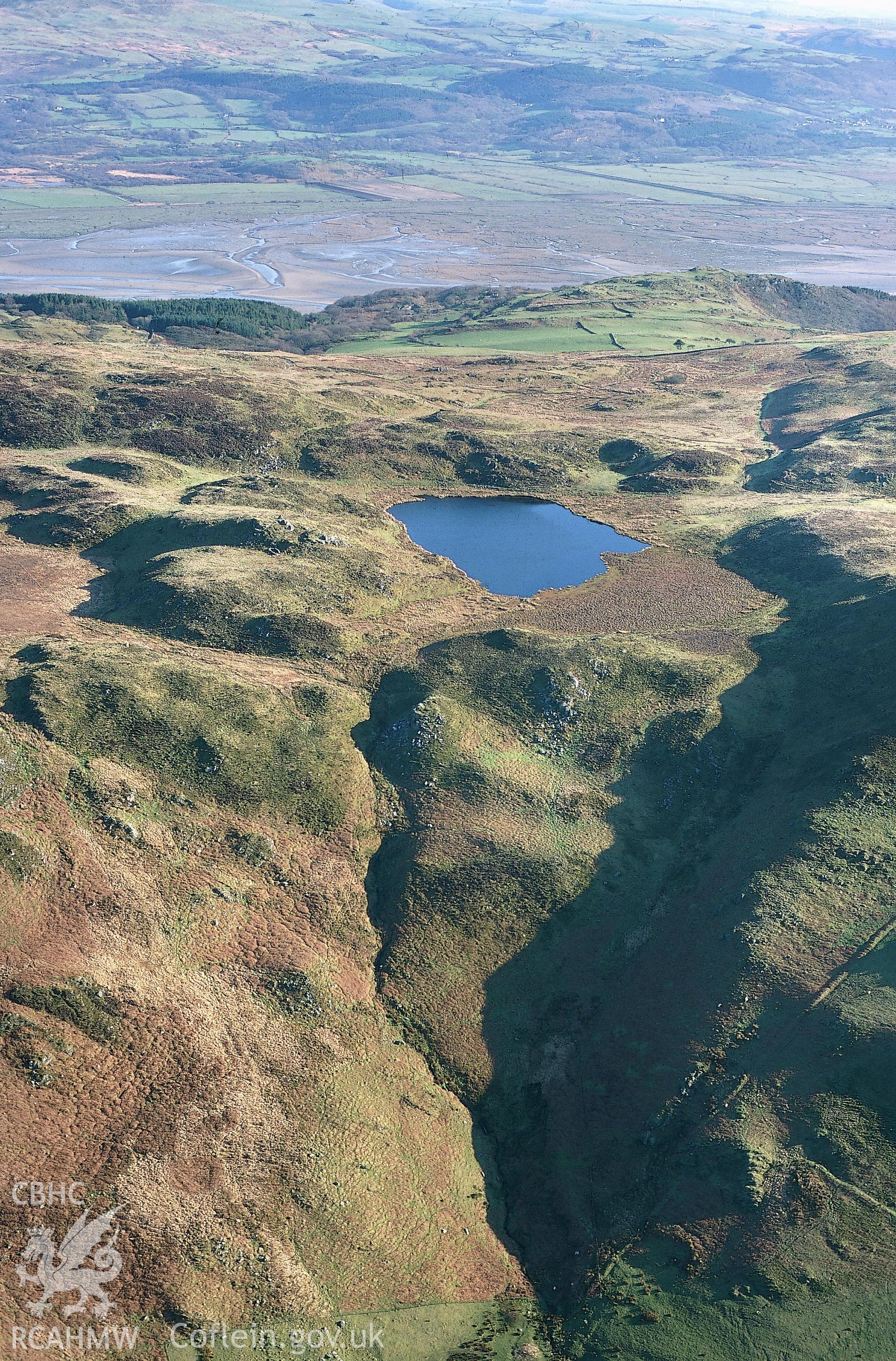 RCAHMW colour slide oblique aerial photograph of Llyn Barfog, Mynydd Y Llyn, Towyn, taken on 17/03/1999 by Toby Driver.