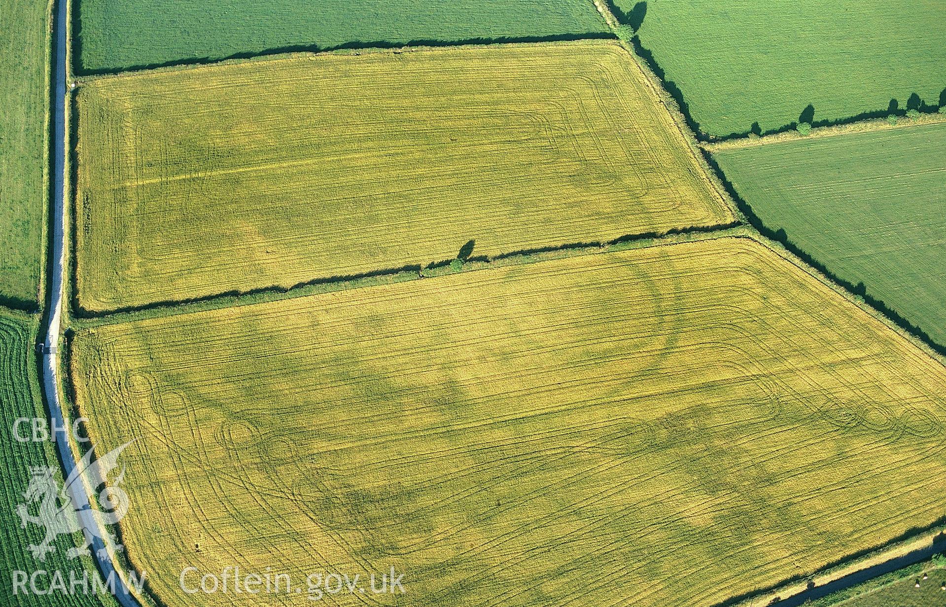 RCAHMW colour slide oblique aerial photograph of enclosure at Waunlle, Y Ferwig, taken by C.R.Musson on the 15/07/1996