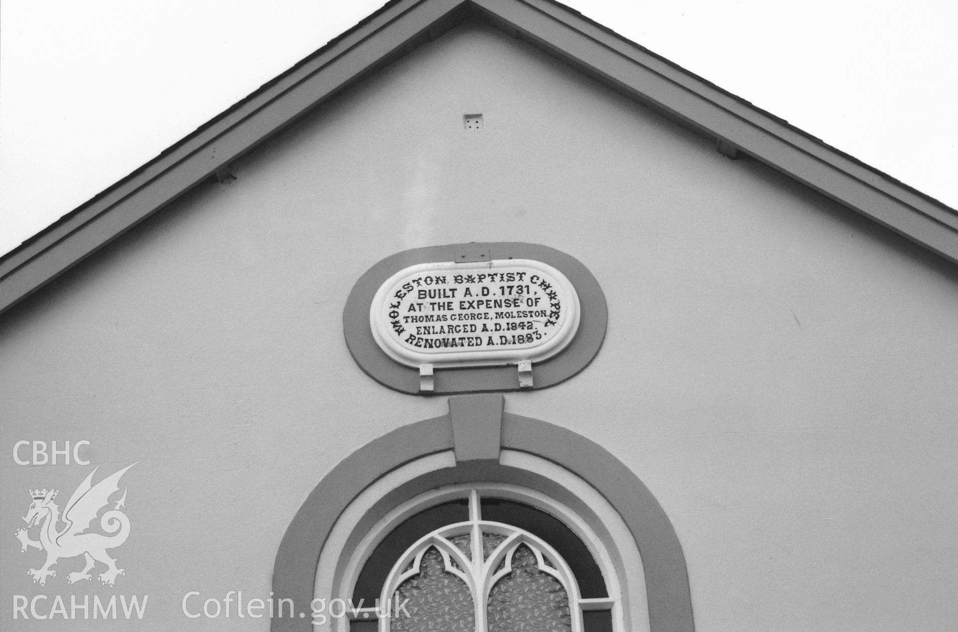 Digital copy of a black and white photograph showing detail of the datestone at Molleston Chapel, taken by Robert Scourfield, 1995.
