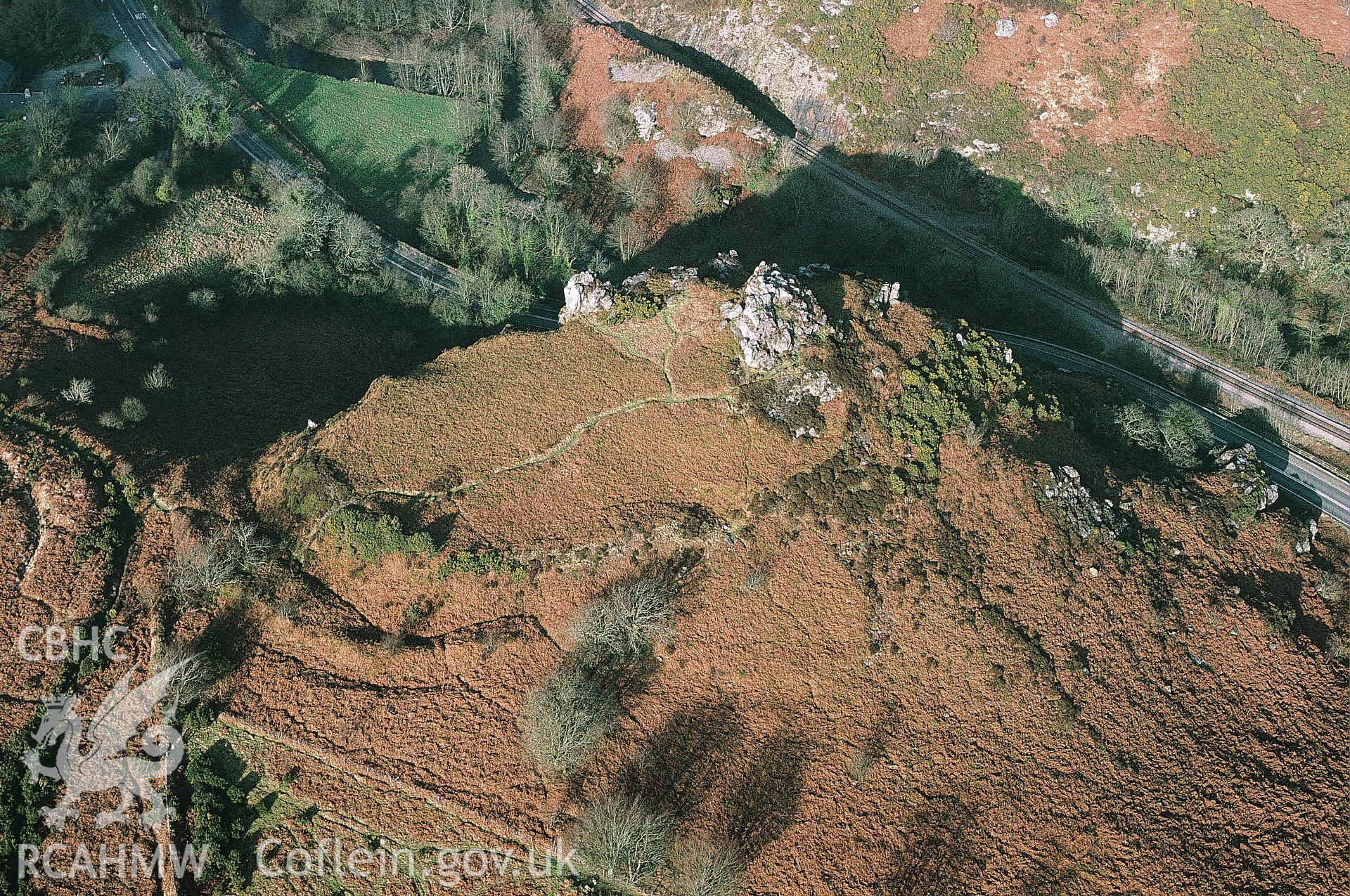 RCAHMW colour slide oblique aerial photograph of Great Treffgarne Rocks Enclosure, Wolfscastle, taken by C.R. Musson, 02/03/94