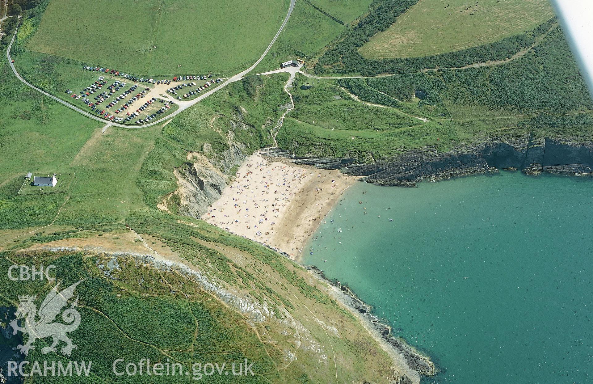 RCAHMW colour oblique aerial photograph of Holy Cross Church, Mwnt Verwig taken on 05/08/2002 by Toby Driver