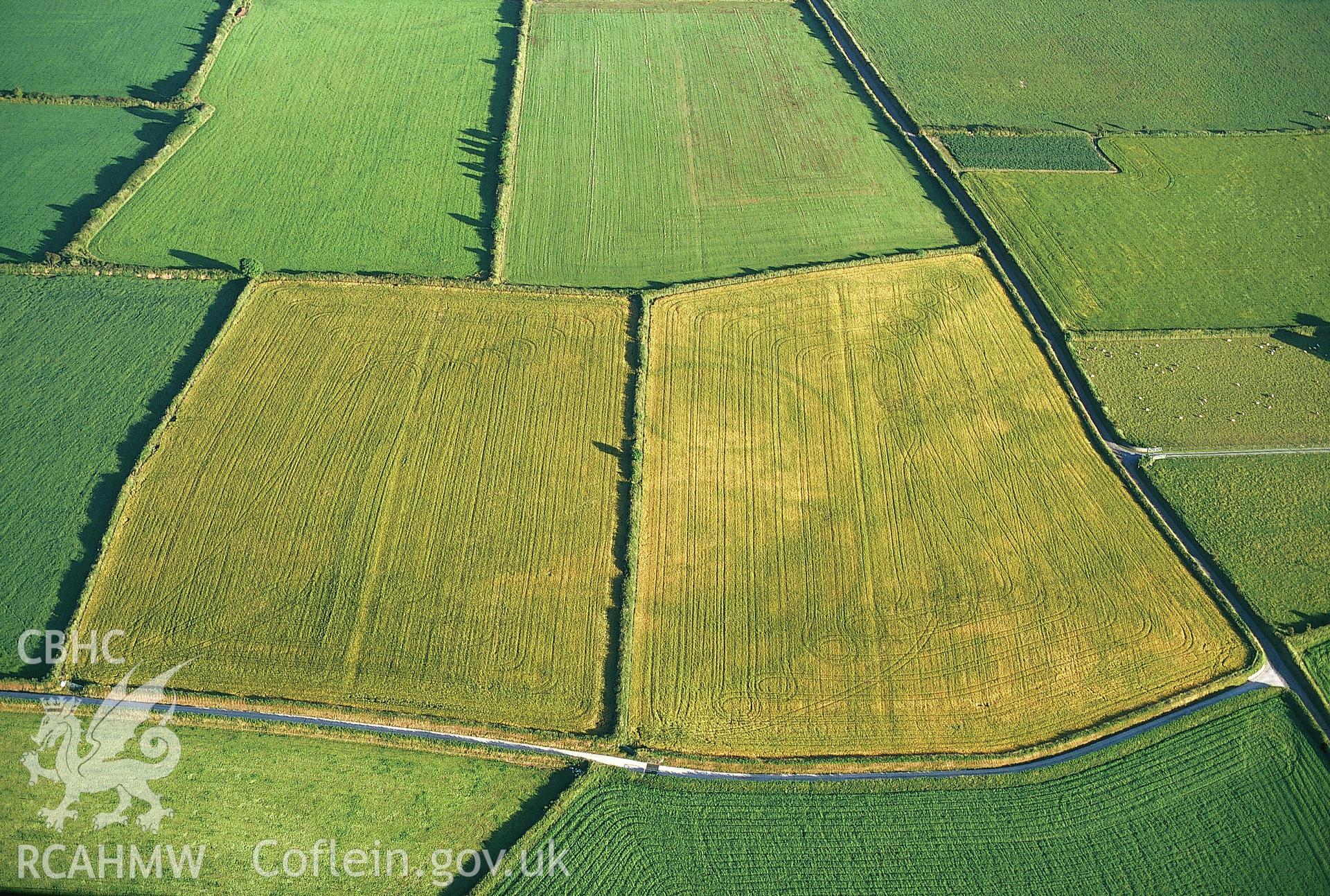 RCAHMW colour slide oblique aerial photograph of enclosure at Waunlle, Y Ferwig, taken by C.R.Musson on the 15/07/1996