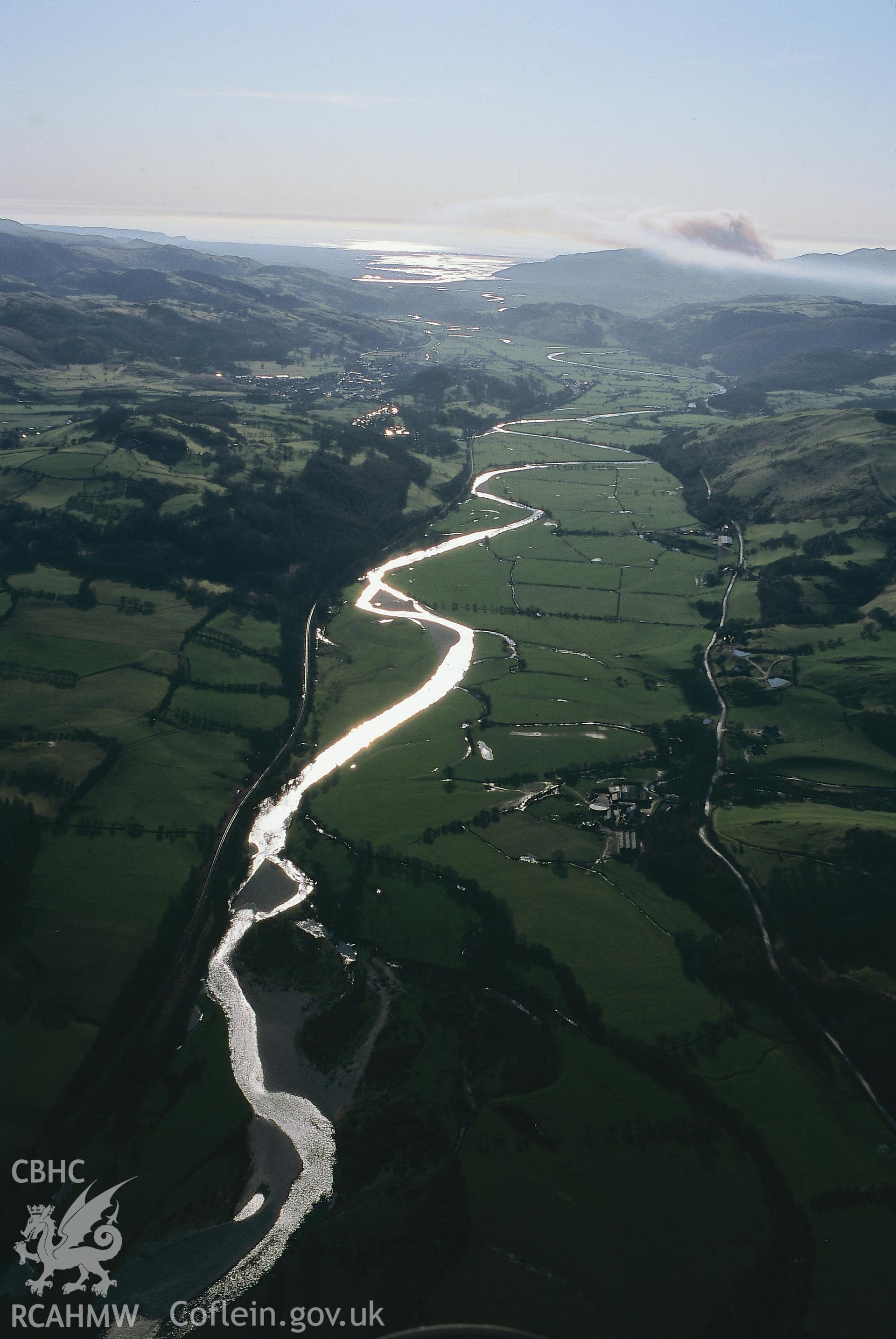 RCAHMW colour slide oblique aerial photograph of the Dyfi Valley landscape west from Ffrydlan, showing Aber Ffrydlan, taken on 17/03/1999 by Toby Driver