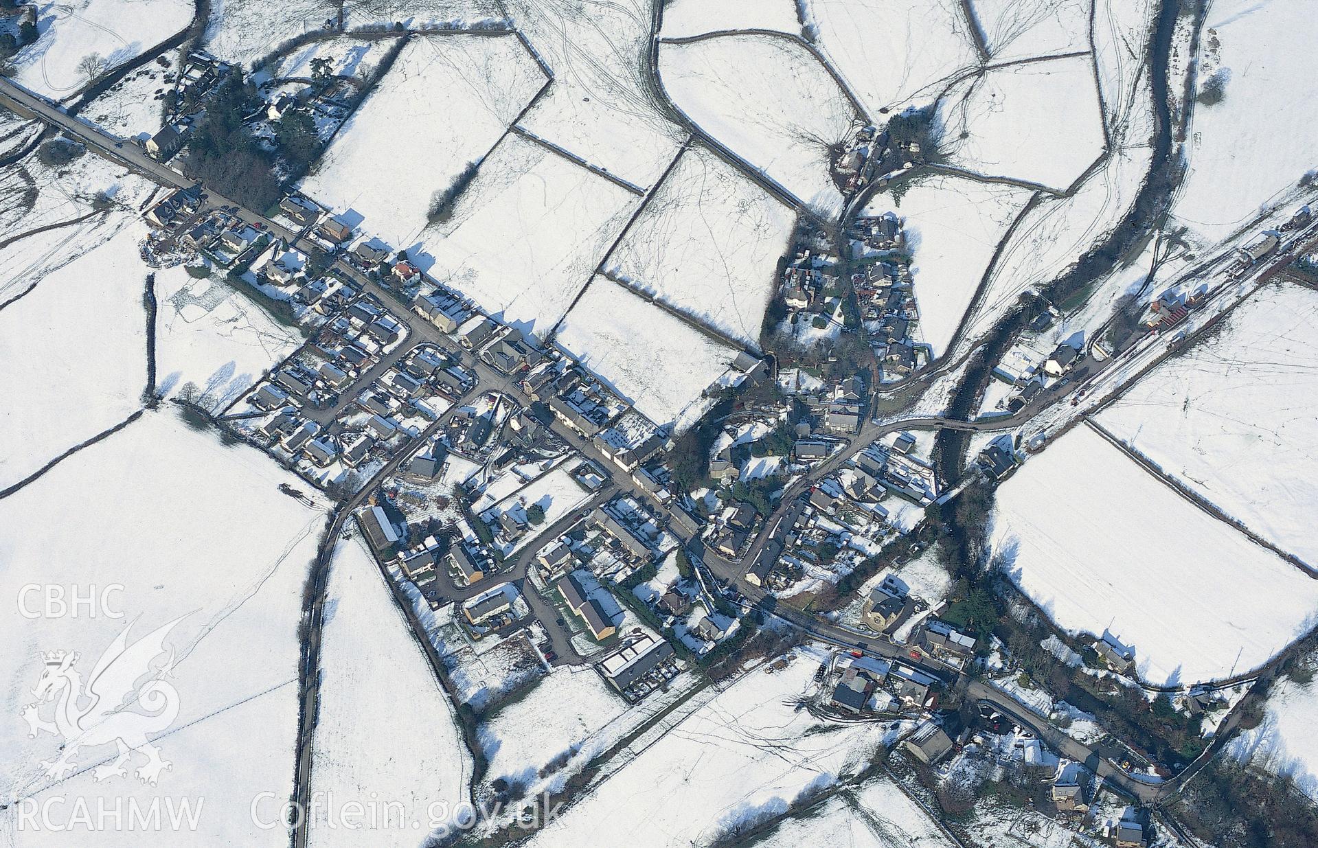 RCAHMW colour oblique aerial photograph showing the railway station at Llanuwchllyn. Taken by Toby Driver 2004.