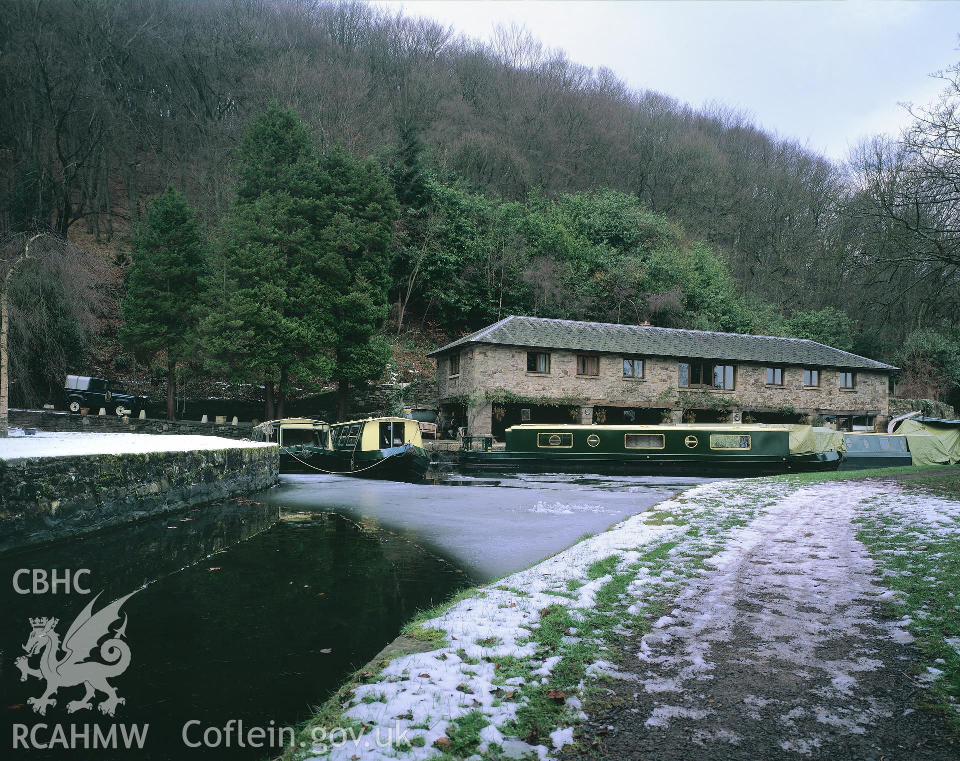 Digitized copy of a colour transparency showing general view of Llanfoist Wharf, Brecknock and Abergavenny Canal taken by Iain Wright, 2004. Original not yet transferred to NMR Archive.
