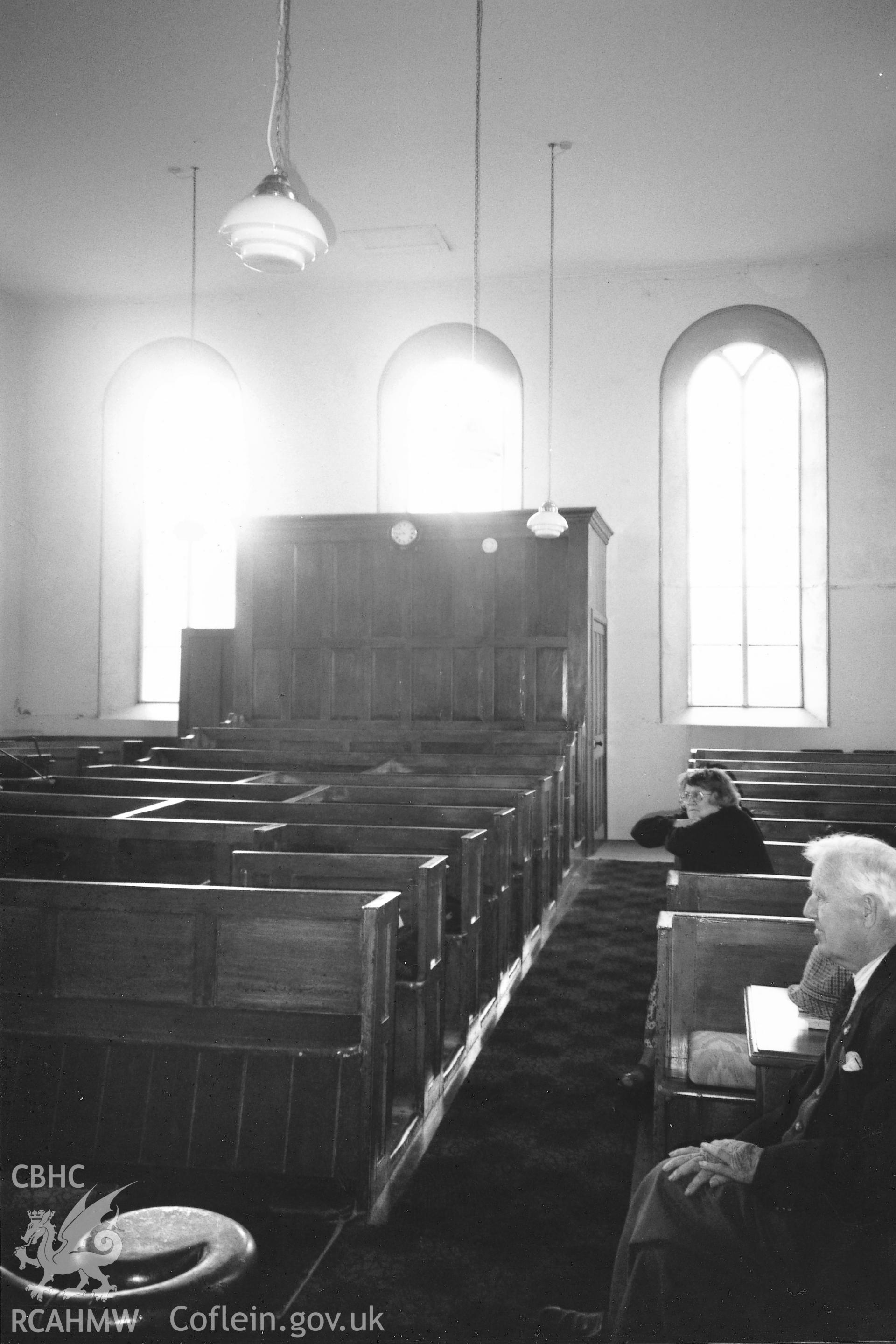 Digital copy of a black and white photograph showing a general interior view of Ebenezer Baptist Chapel, Cold Inn, taken by Robert Scourfield, 1996.