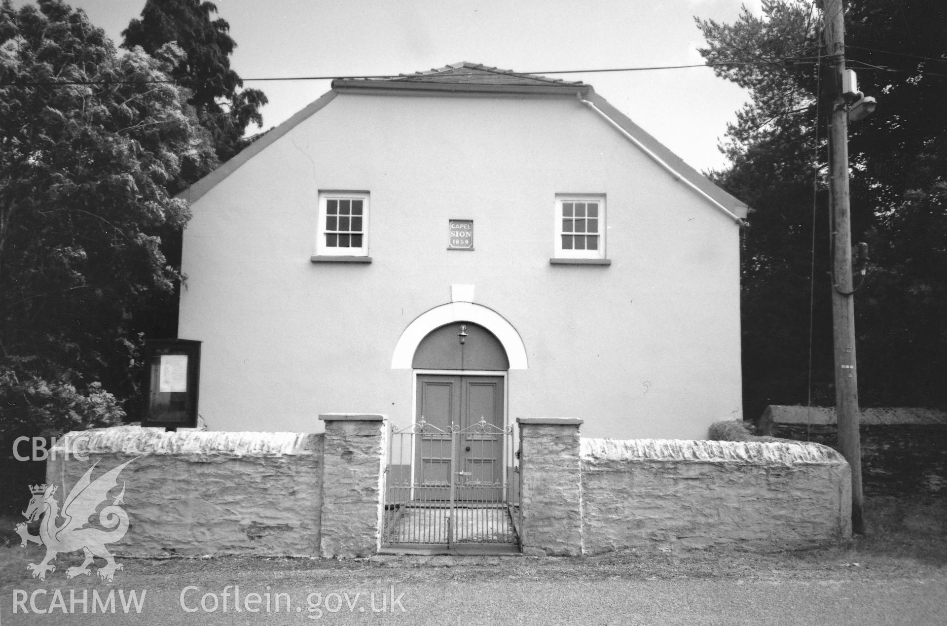 Digital copy of a black and white photograph showing a general view of Sion Welsh Baptist Chapel, Scleddau, taken by Robert Scourfield, 1996.
