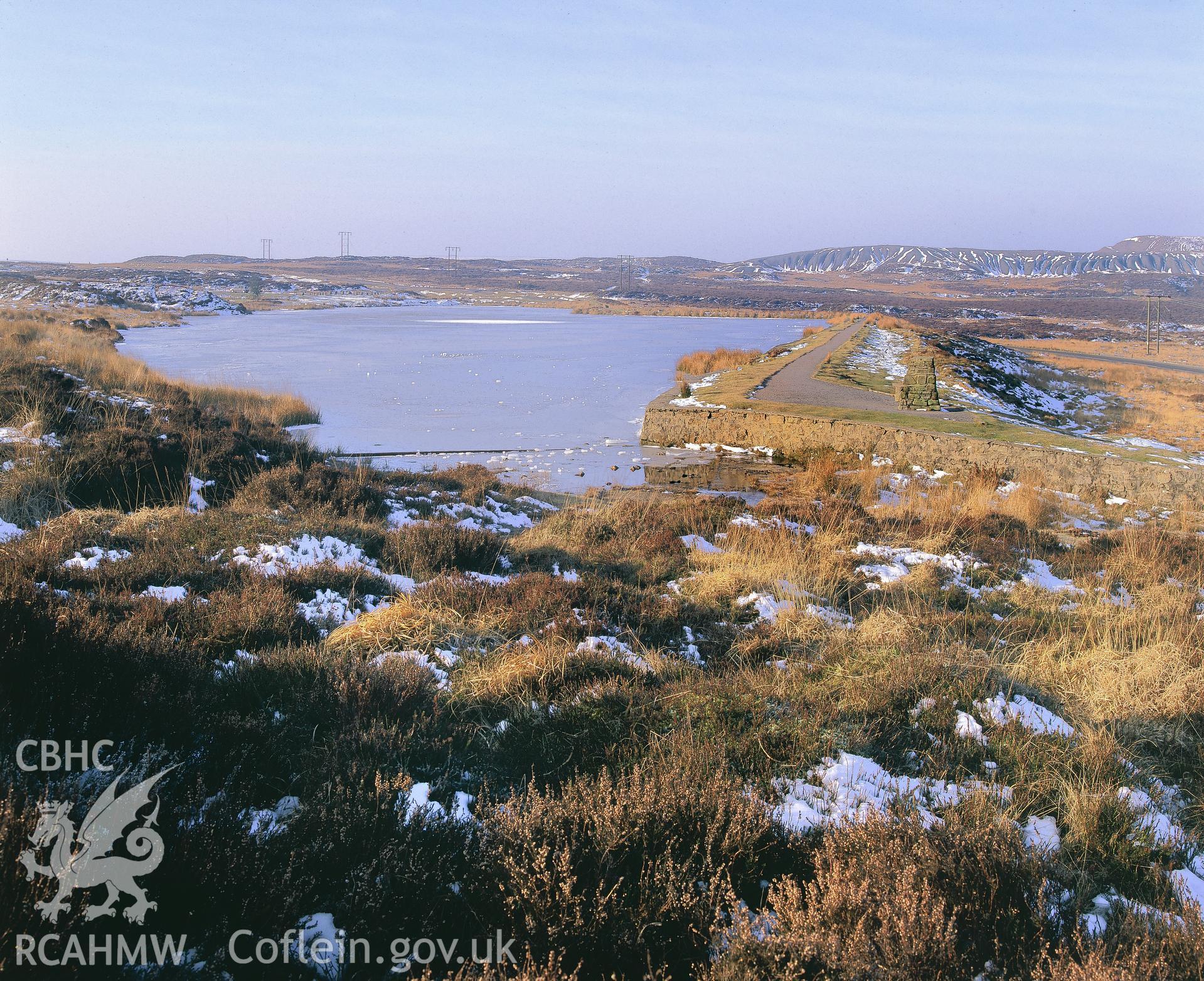 Colour transparency showing general view of Pen-Ffordd-Goch Pond taken by Iain Wright, 2004.