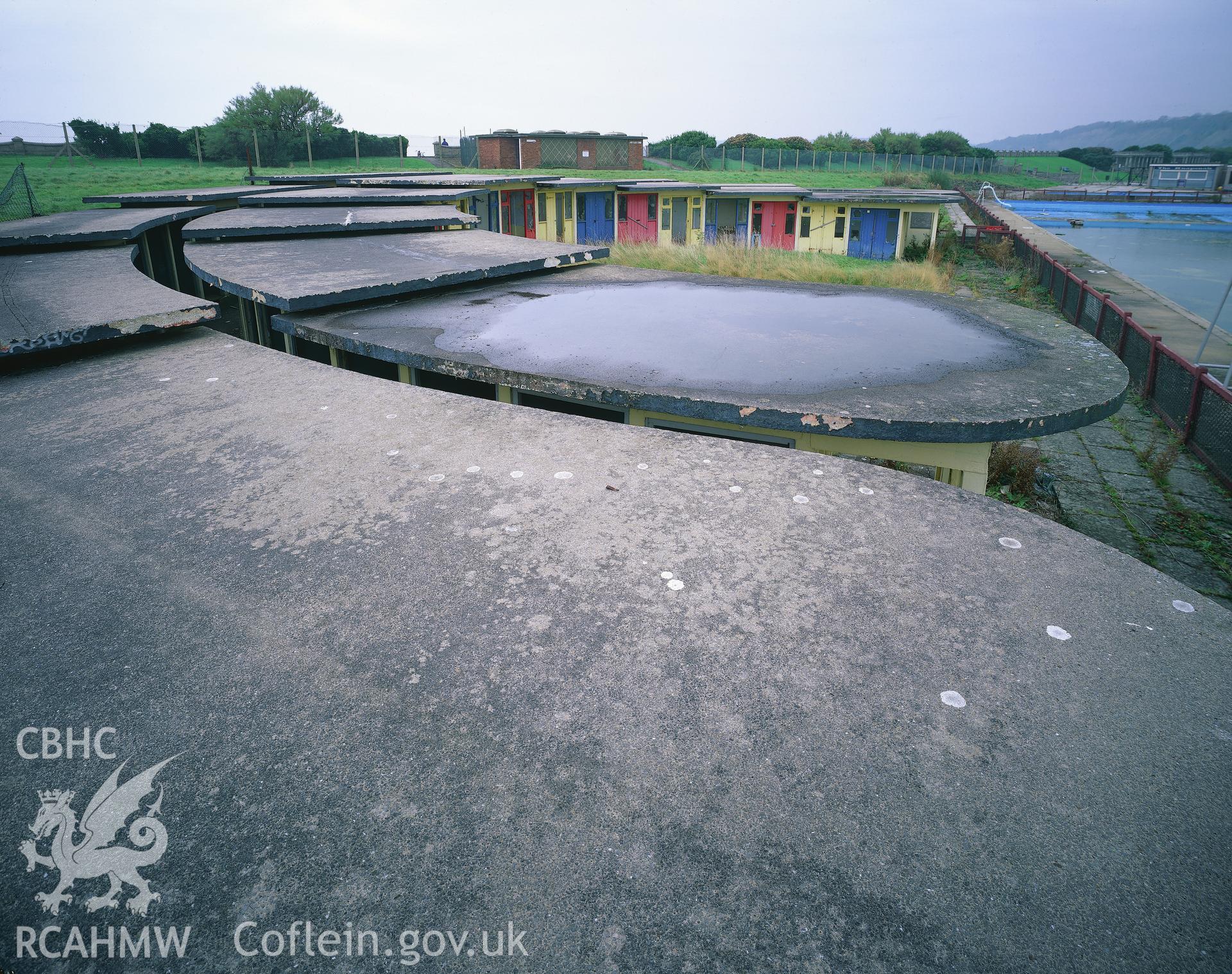 RCAHMW colour transparency showing view over the roofs of the changing cubicles at Cold Knap Lido, Barry.