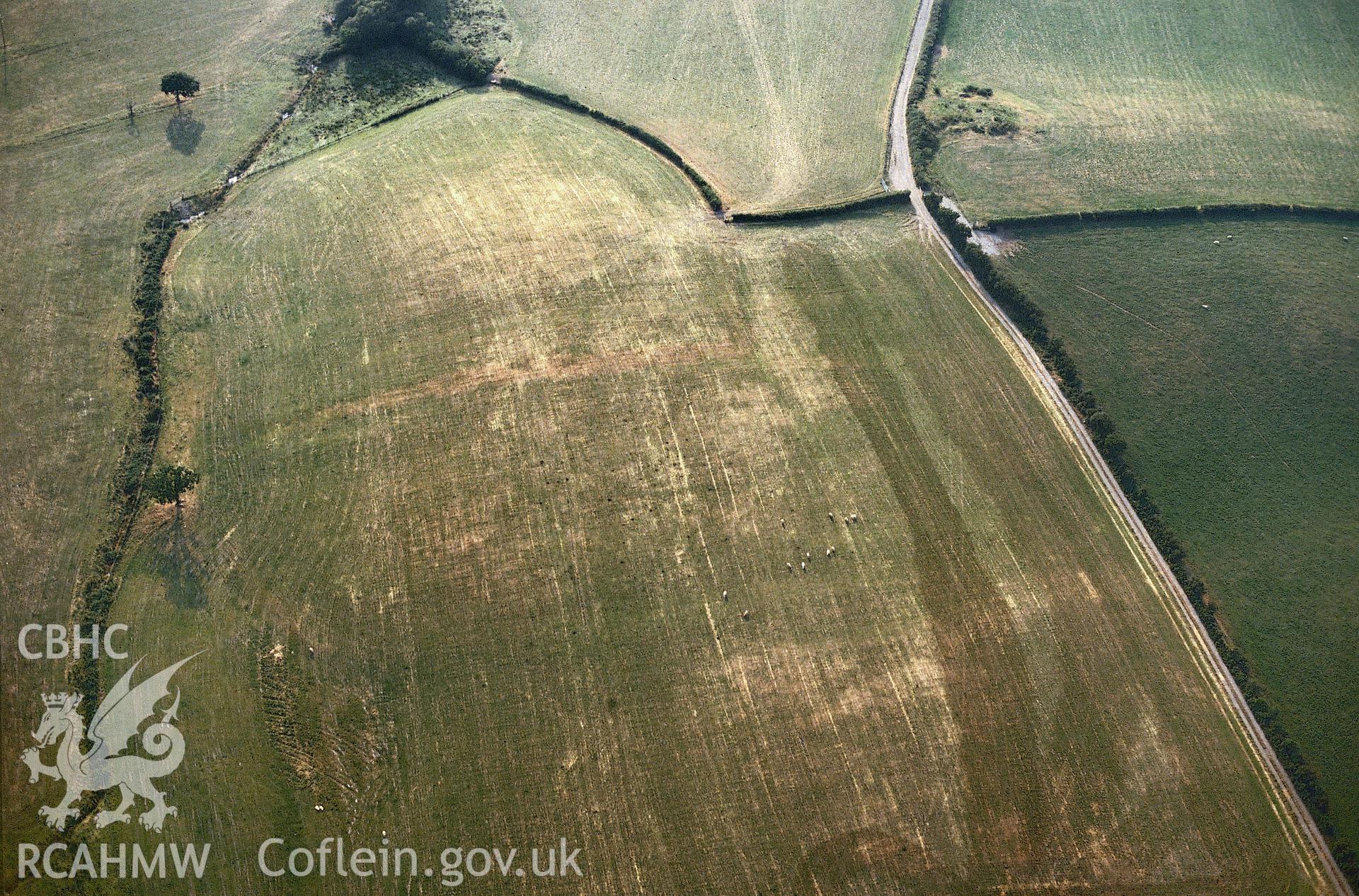 Slide of RCAHMW colour oblique aerial photograph of cropmarks at Berth-lwyd, Llanilar, taken by C.R. Musson,1990.