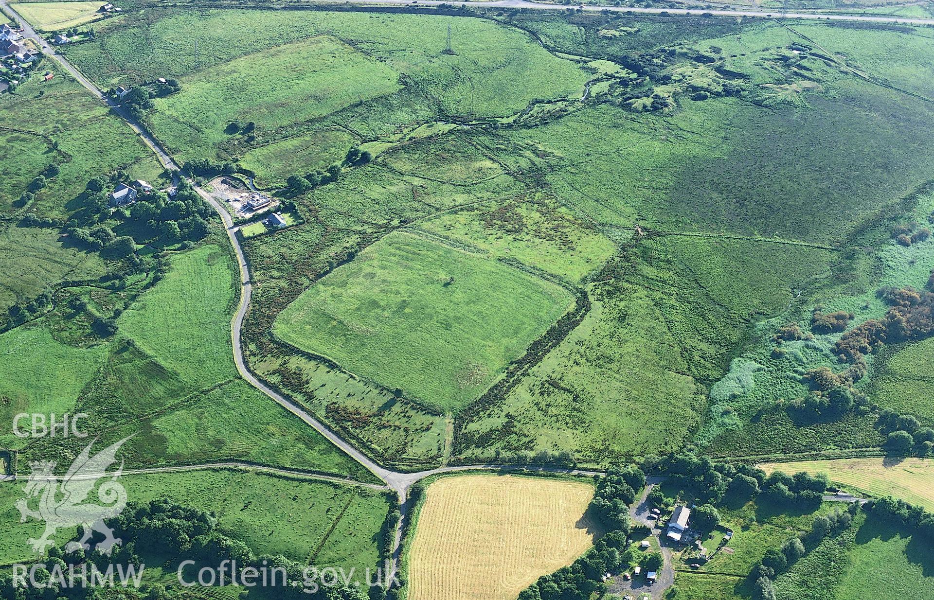 RCAHMW colour slide oblique aerial photograph of Coelbren Roman Fort, Onllwyn, taken on 26/07/1999 by Toby Driver.