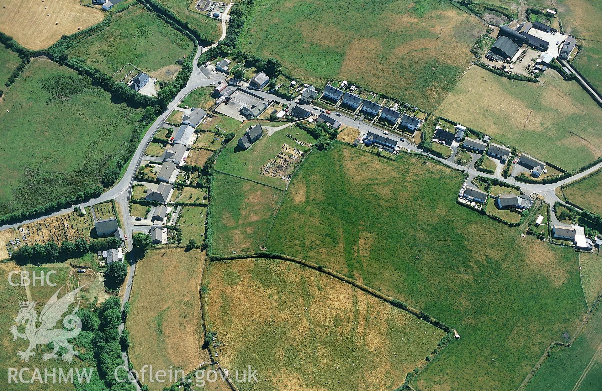 Slide of RCAHMW colour oblique aerial photograph showing cropmarks north of St Pedrog's Church, Y Ferwig,  taken by Toby Driver 1996.