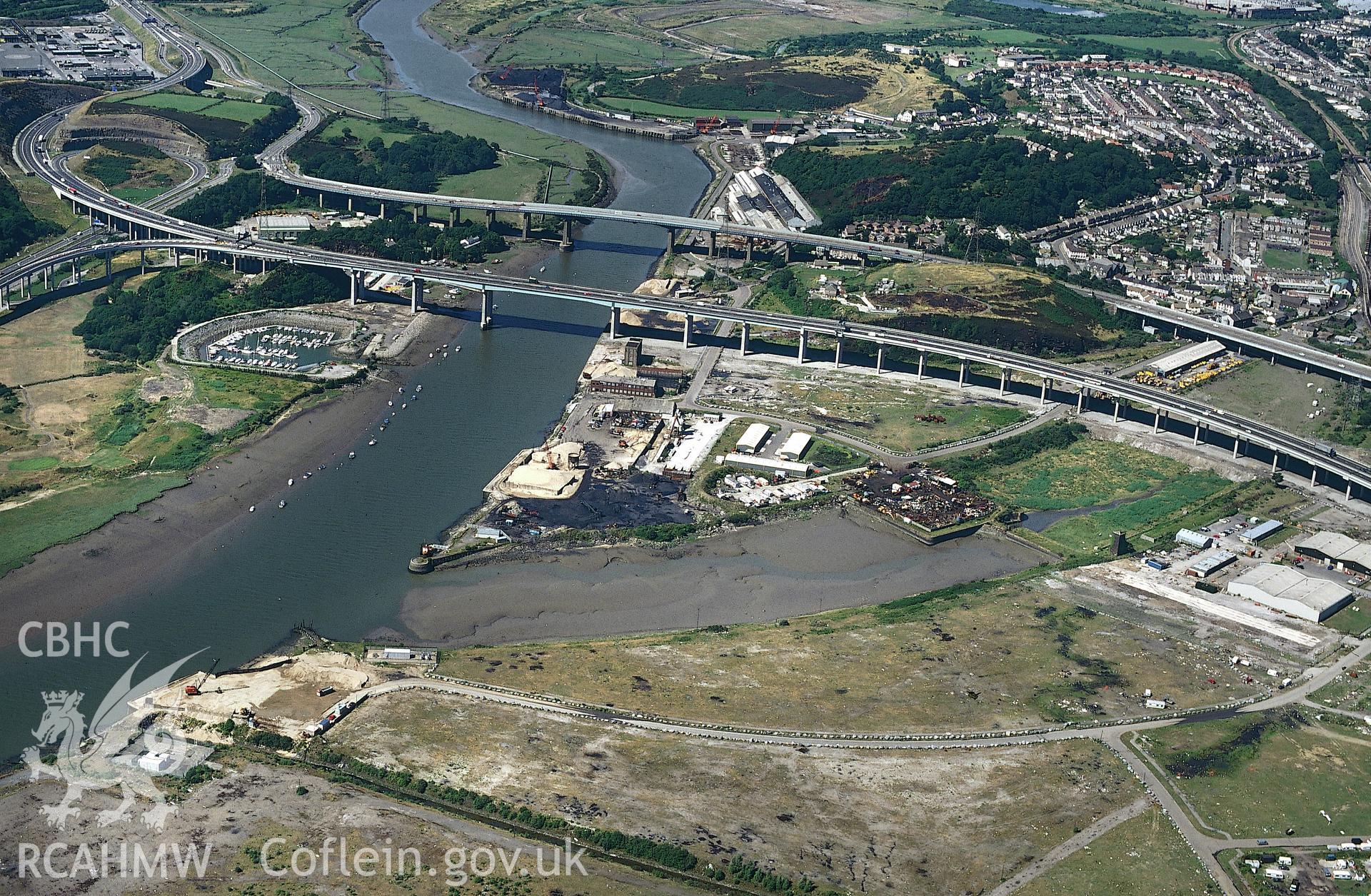Slide of RCAHMW colour oblique aerial photograph of Neath Bridge and Old Docks, taken by C.R. Musson, 1995.