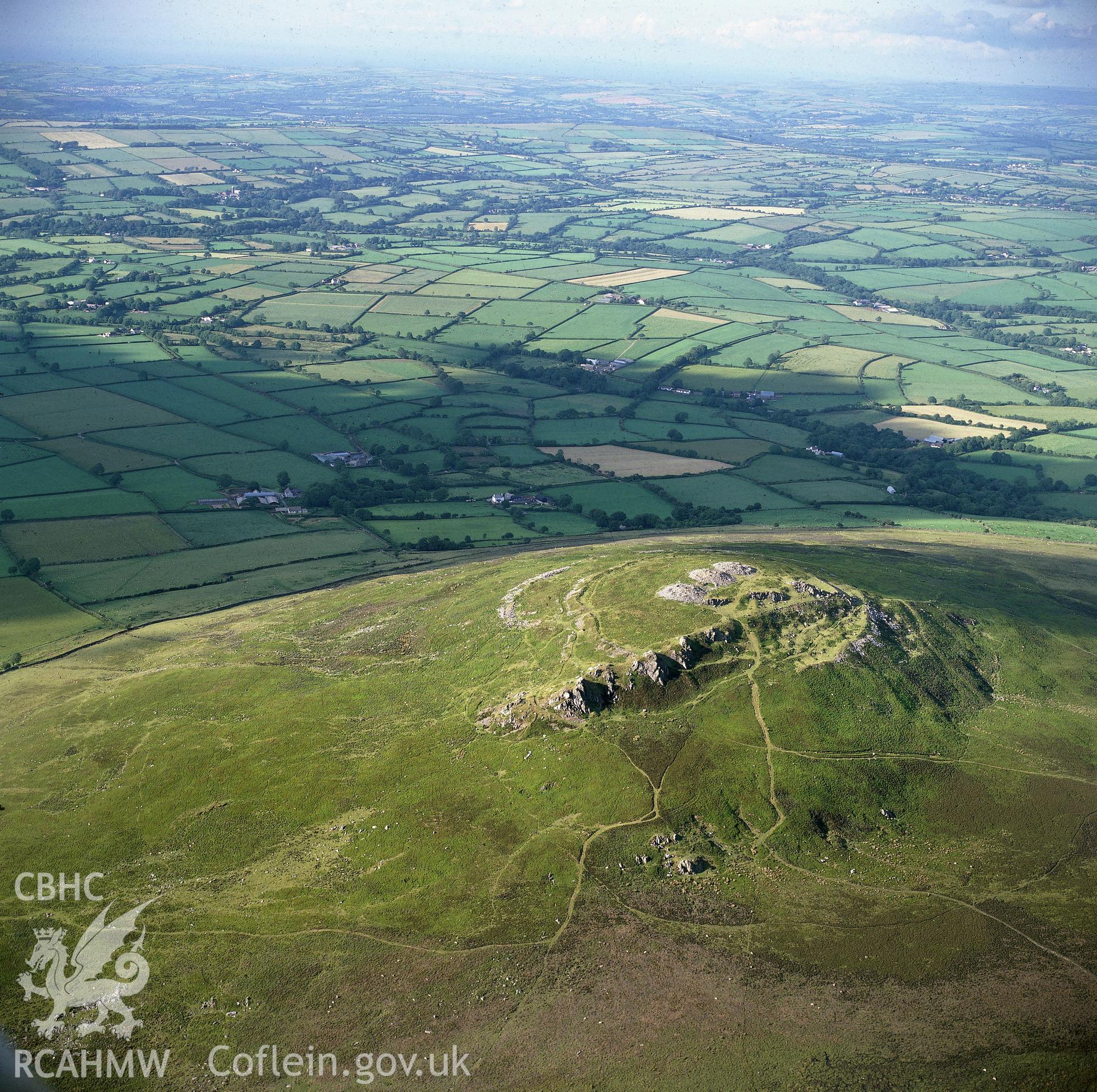 RCAHMW black and white oblique aerial photograph of Foel Drygarn Camp, taken by C R Musson, 27/02/1996.