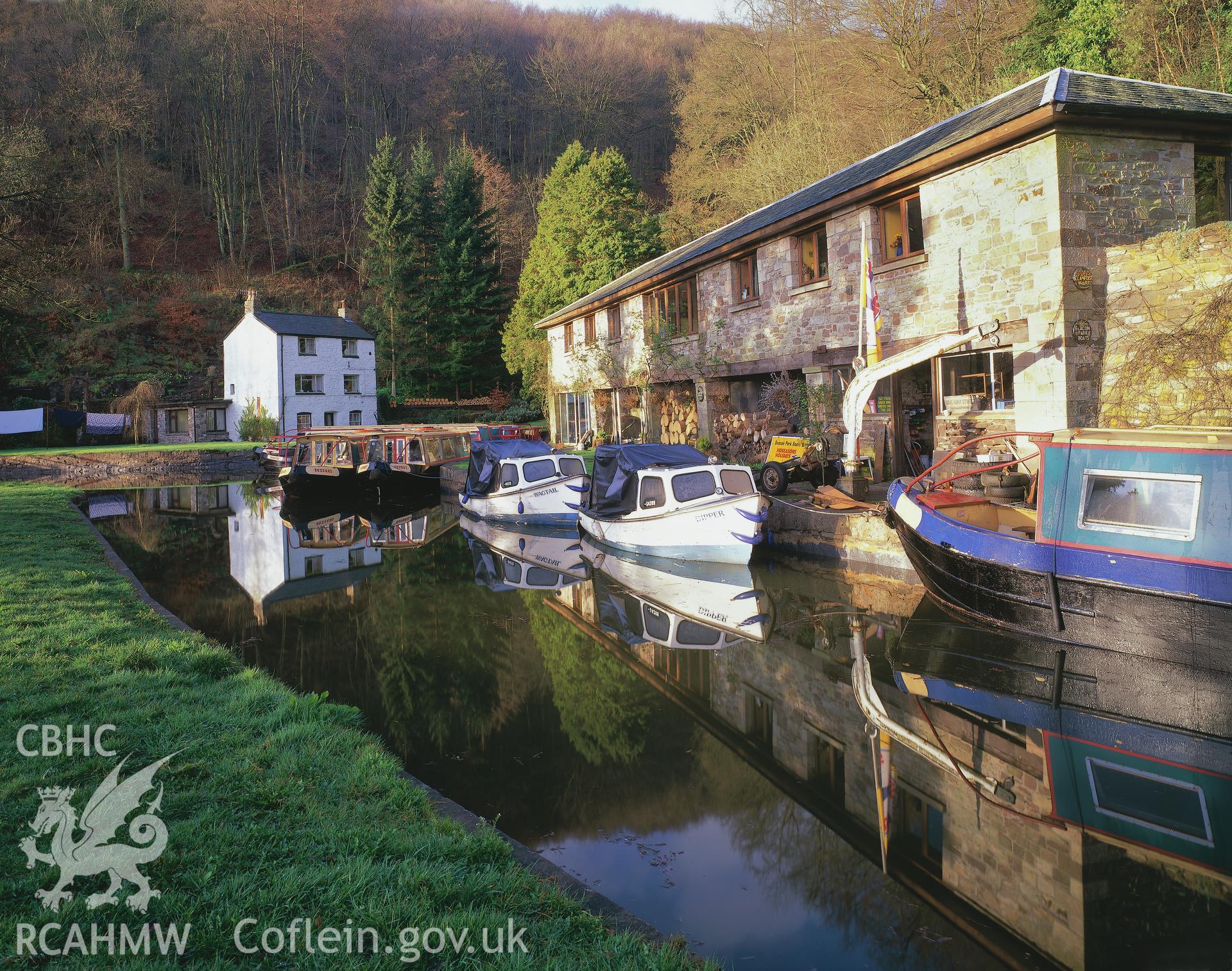 Digitized copy of a colour transparency showing general view of Llanfoist Wharf, Brecknock and Abergavenny Canal taken by Iain Wright, 1999. Original not yet transferred to NMR Archive.